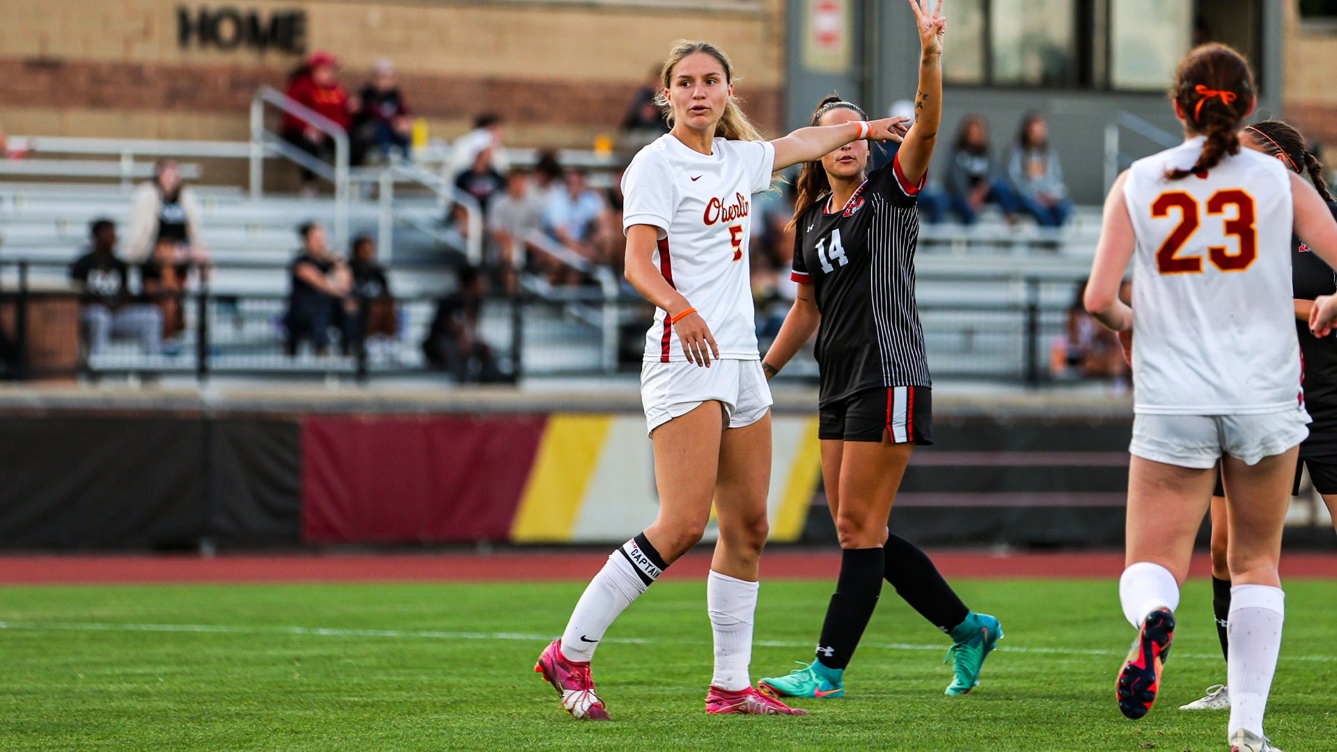 Jemma Freestone pointing downfield on the pitch