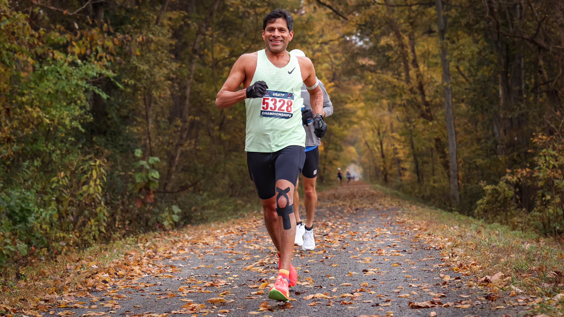 Harsha Thirumurthy '98 running on a trail during the USATF 50 Mile Road Championships