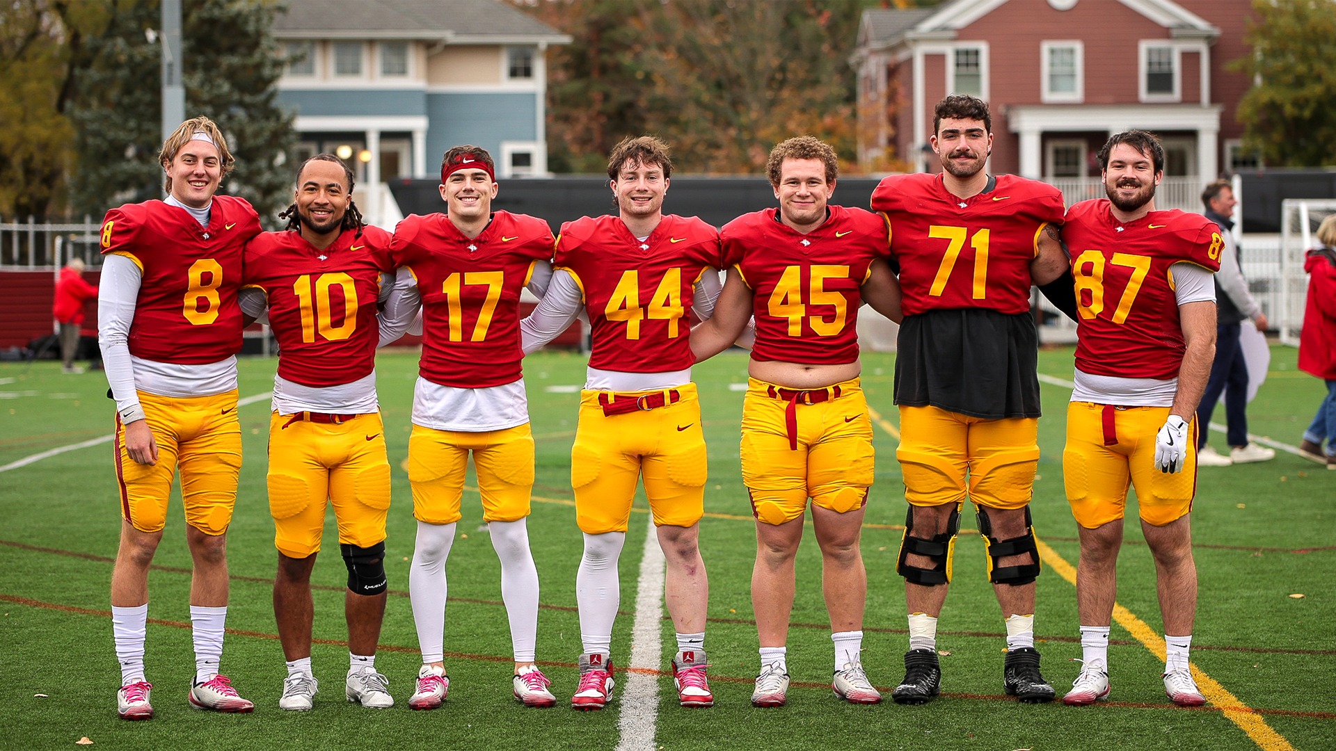 Oberlin College Football seniors smiling in photo together