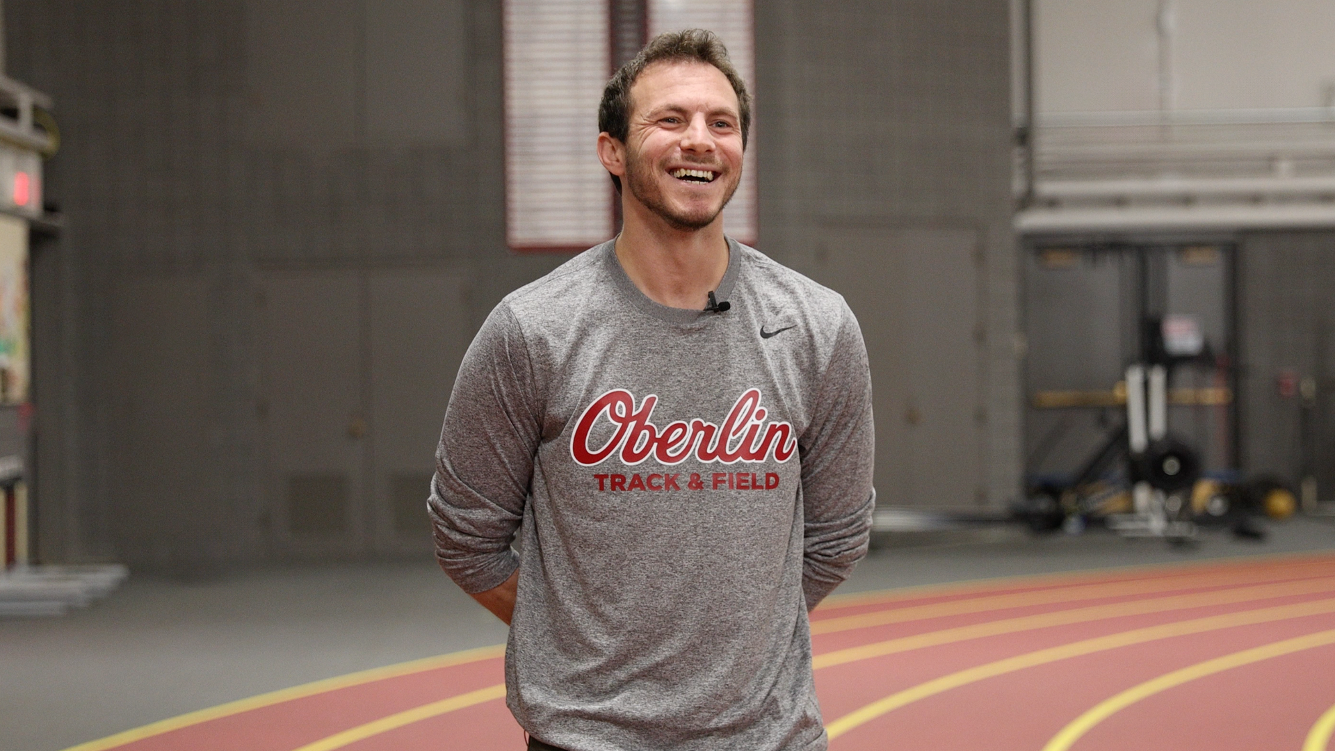 Ben Wach smiling during interview on indoor track