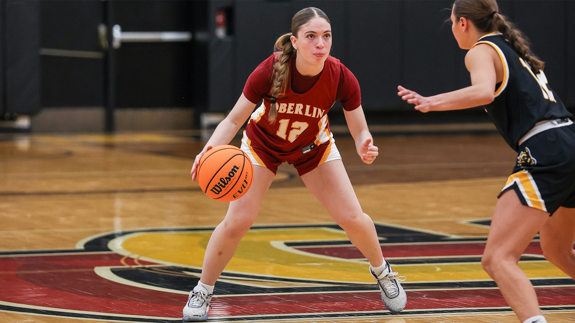 Noa Brown dribbling the ball against Wooster