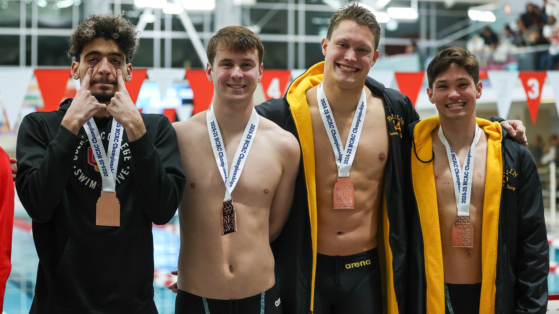 Chahine Saïd, Erik Fendorf, Isaac Viviano, and Myles Felt smiling with NCAC medals