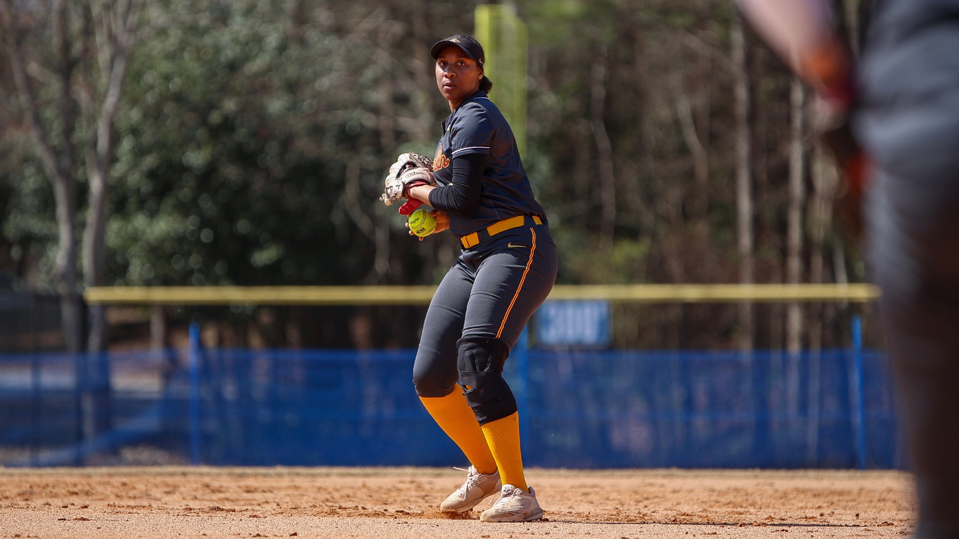 Maya Means fielding a softball