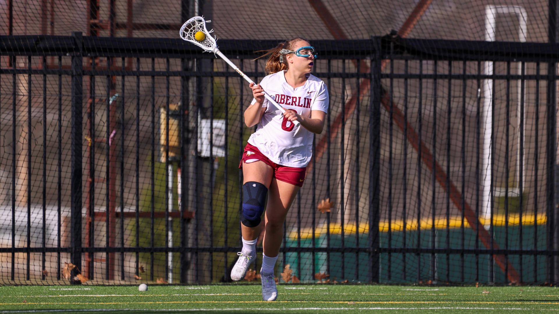 Kylie Thompson sprinting with the ball in her stick