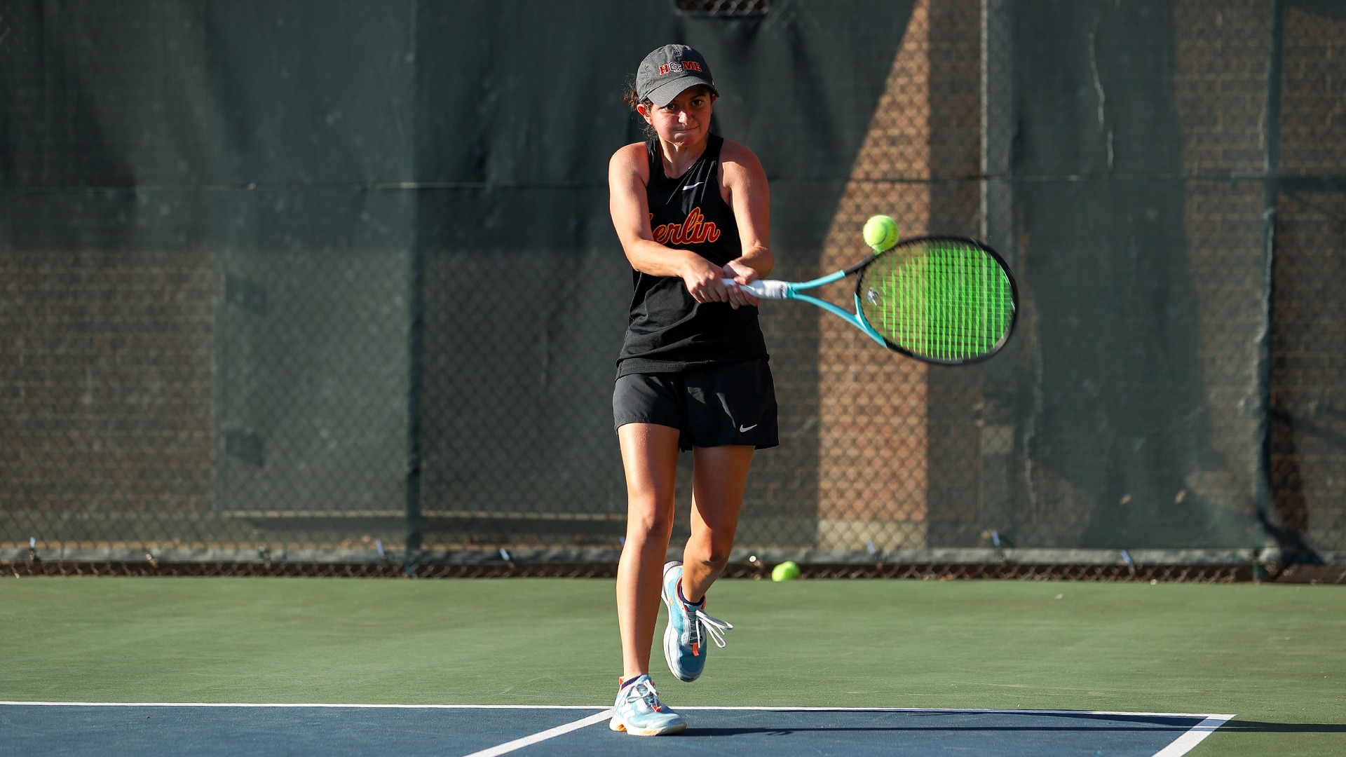 Eva Lopez staring down a ball to hit with her racket