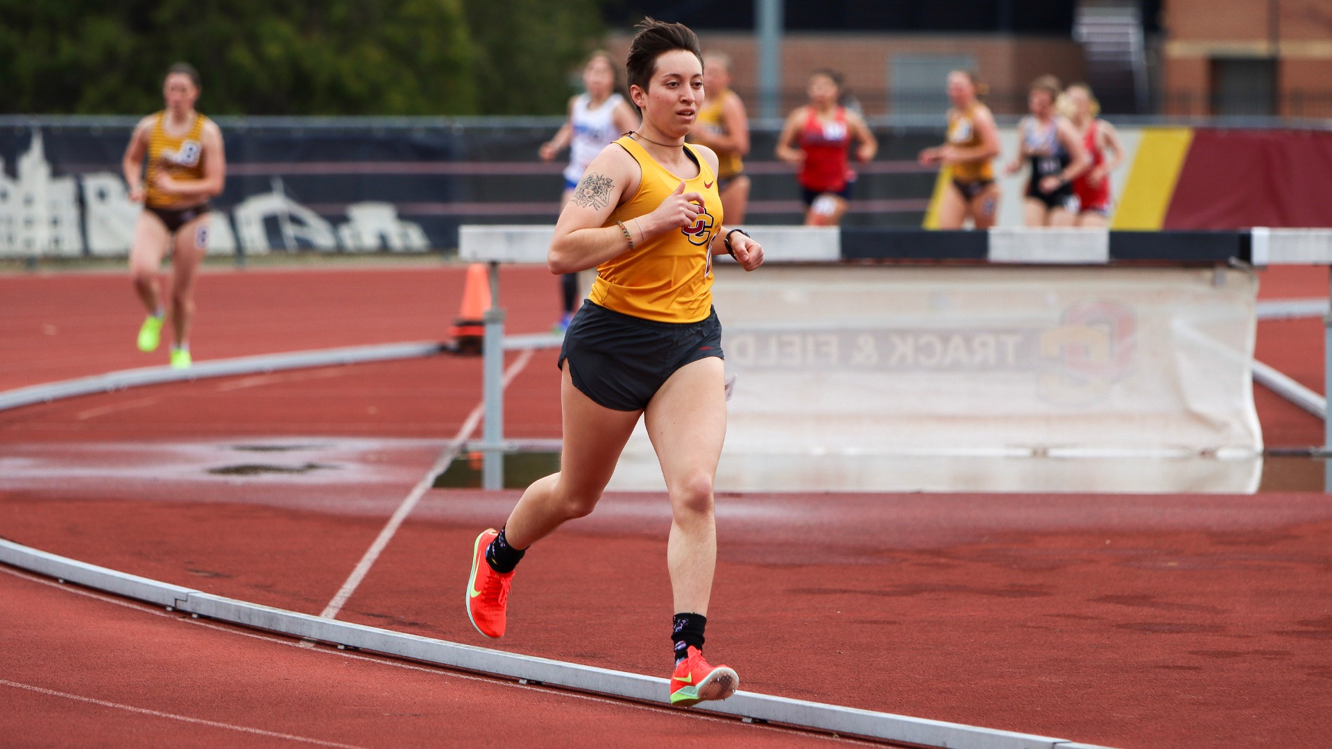 Sage Serraino running around the track