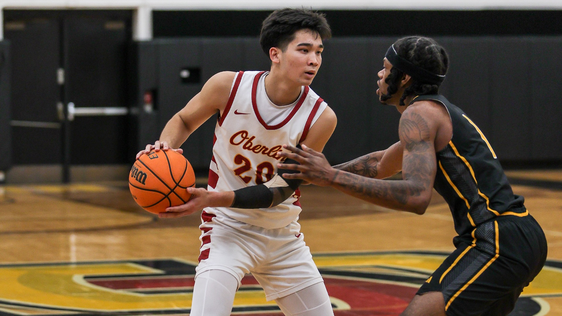 JJ Gray holds the basketball