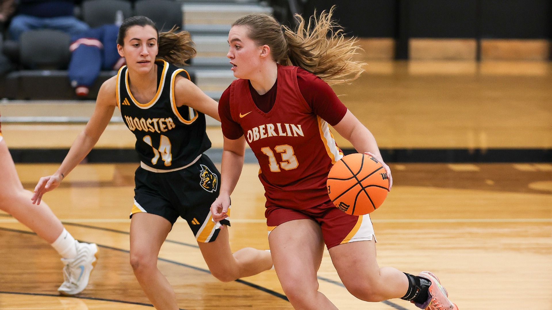 Lily Najmulski dribbling the ball around a defender