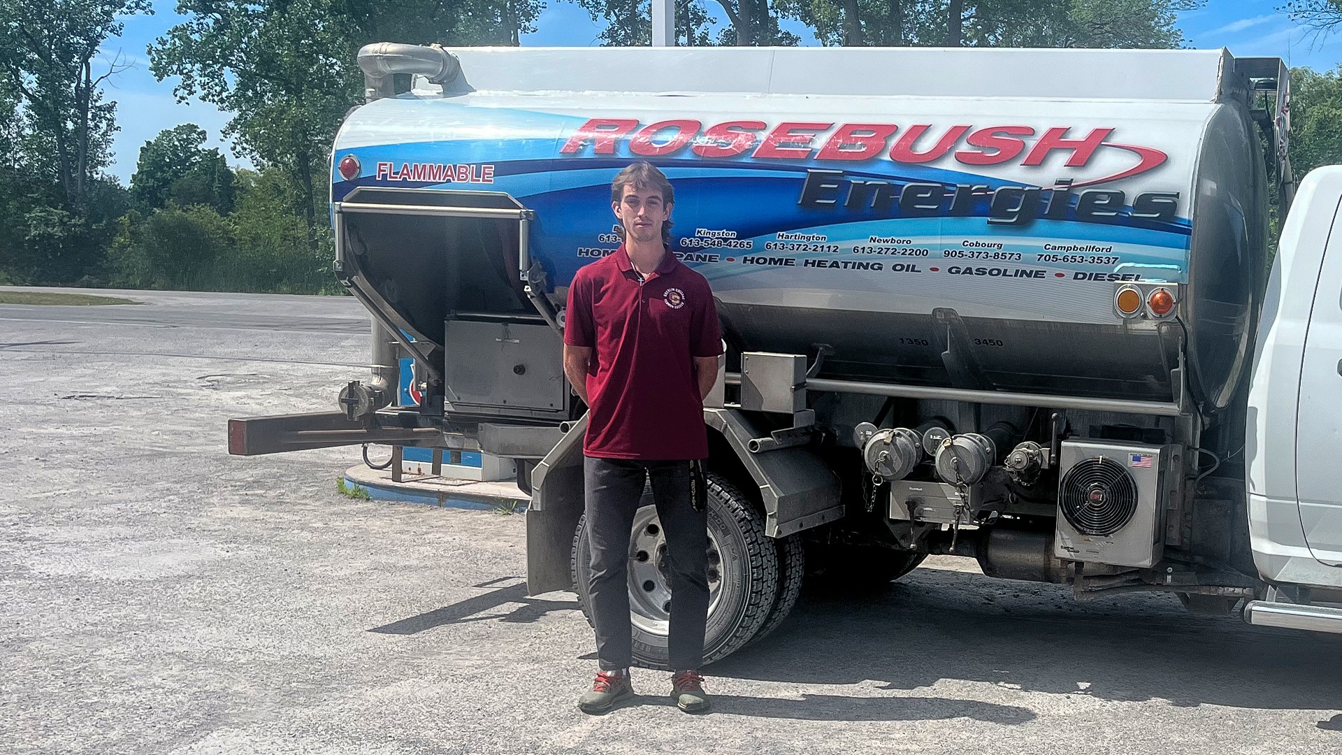 Michael Dolton stands in front of oil truck