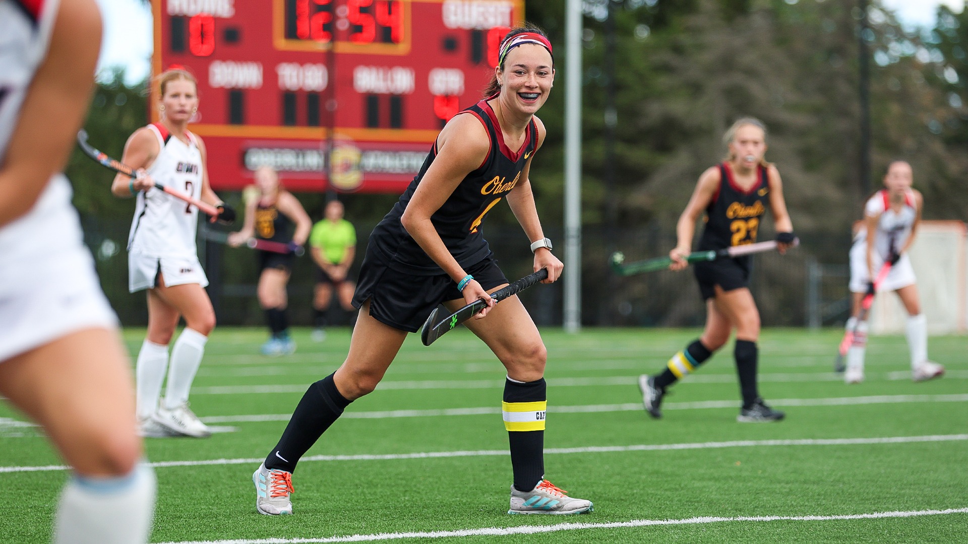 Claire Kammeier smiles as she runs down the field