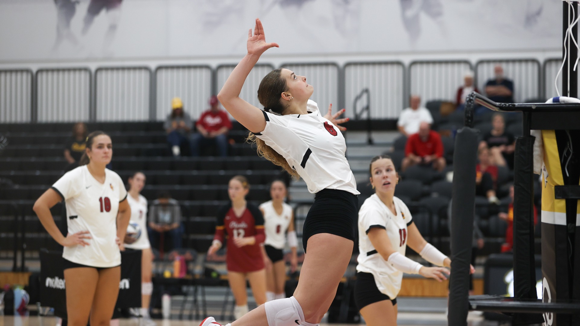 Lucy Goebel jumping up to attack the ball