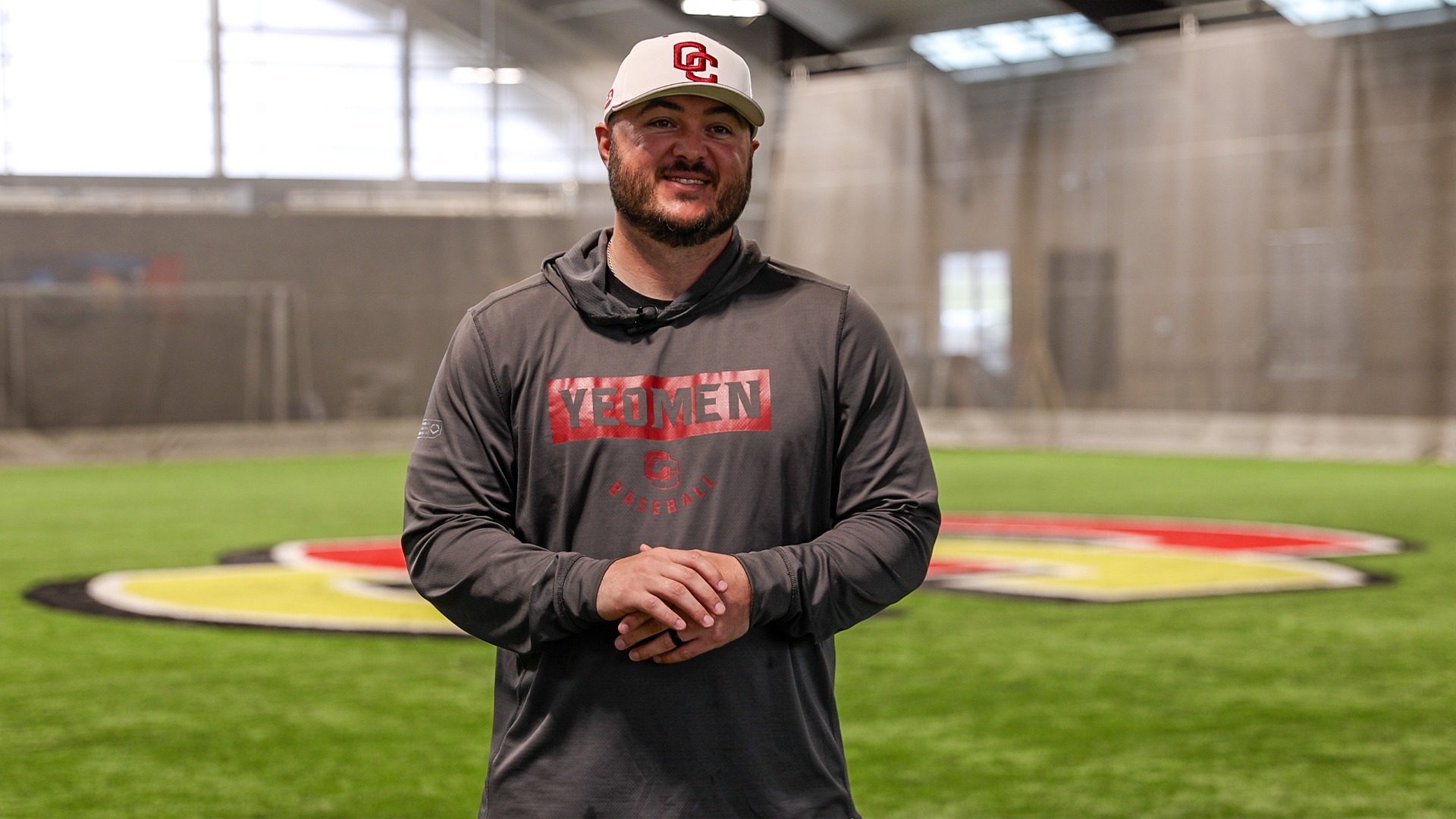 Johnathan Ray smiling at the camera in Williams Field House during interview