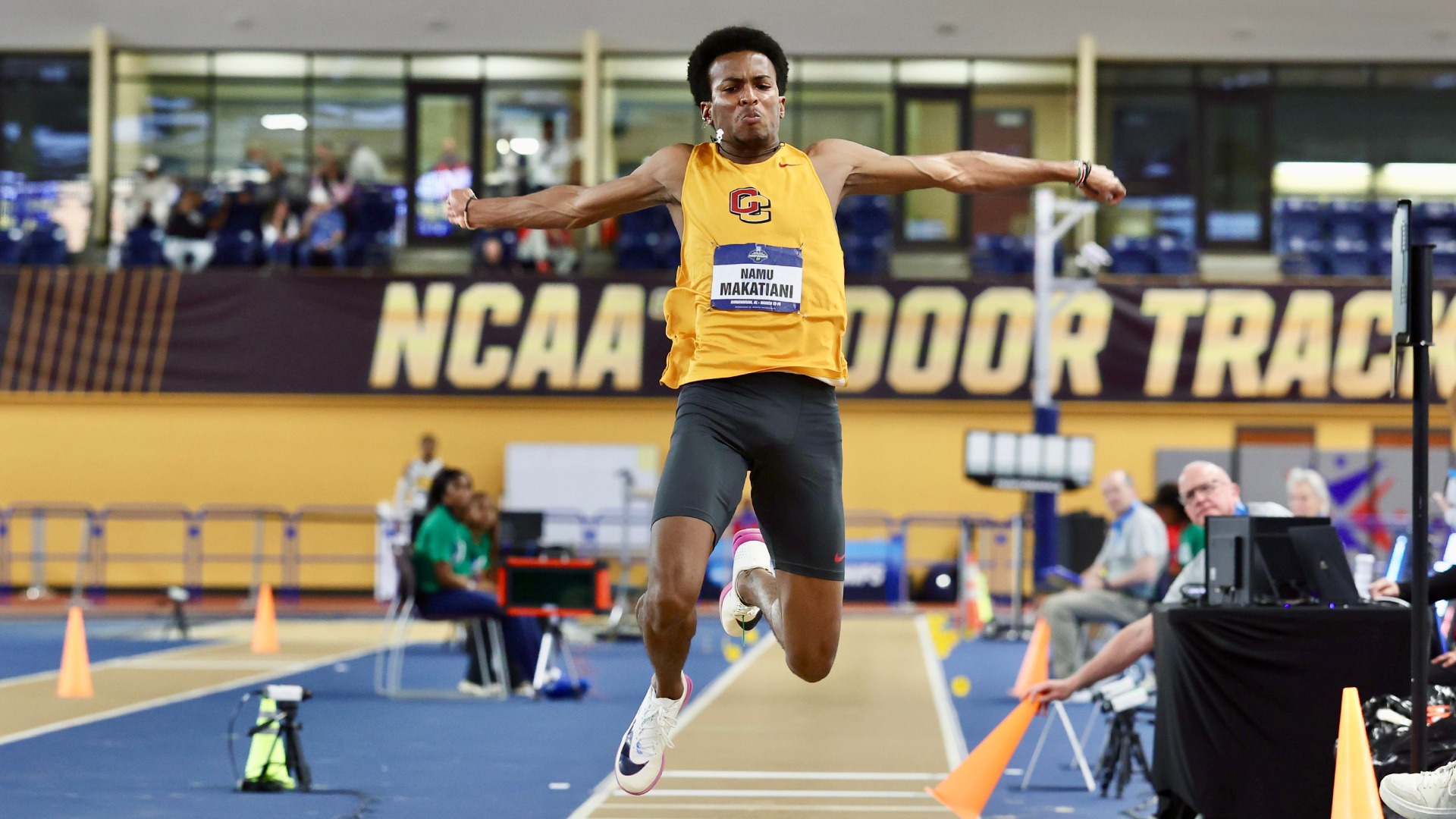 Namu Makatiani jumping off the runway in triple jump at NCAA Championship