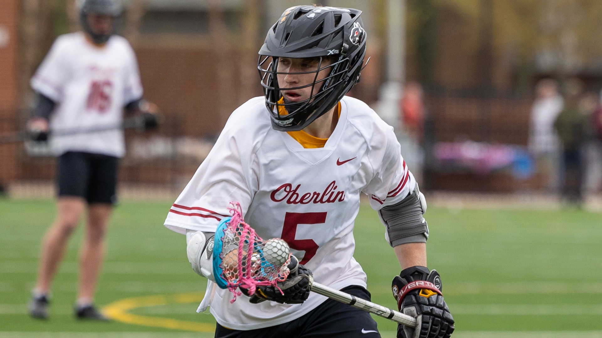 Jacob Starcke running with lacrosse ball in stick