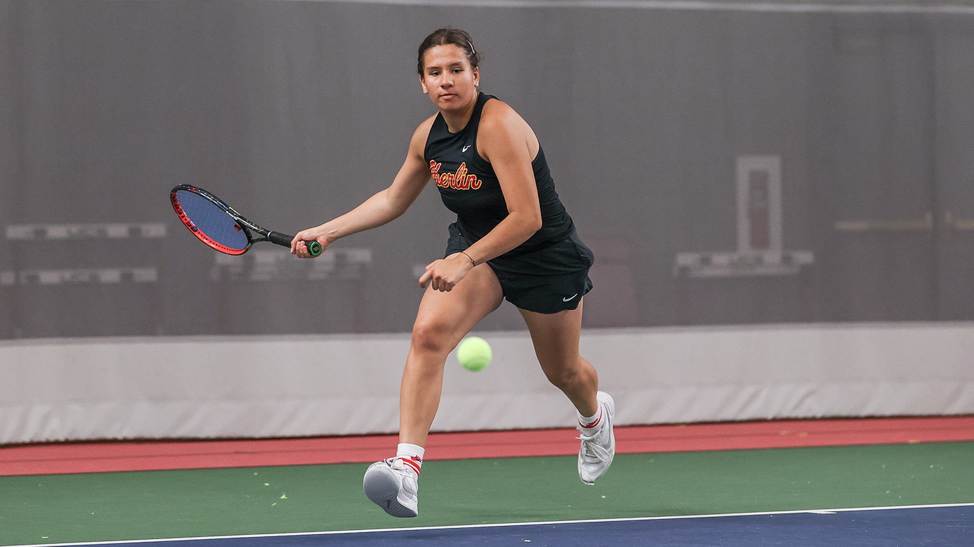 Robyn Gurujal returning a tennis ball