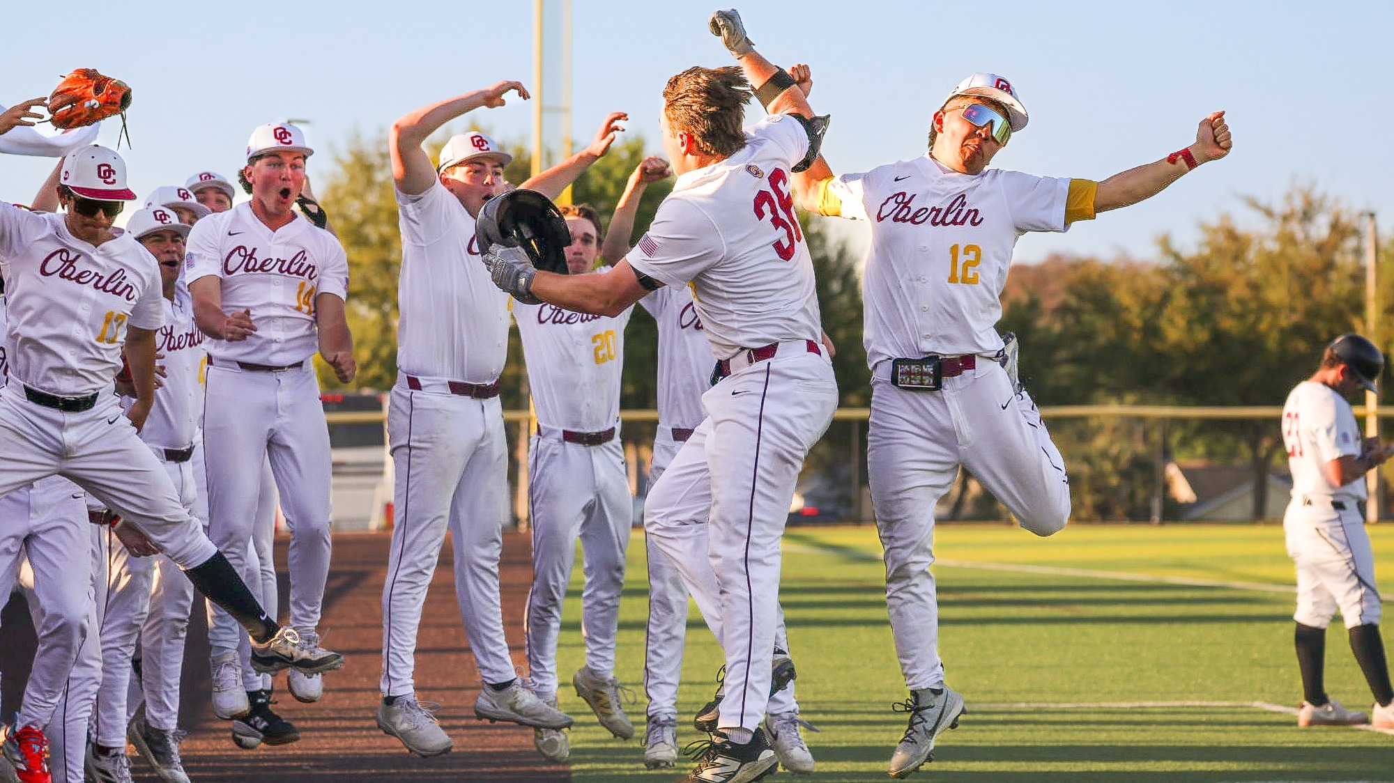 Oberlin College Baseball team celebrating Daniel Krabill's home run