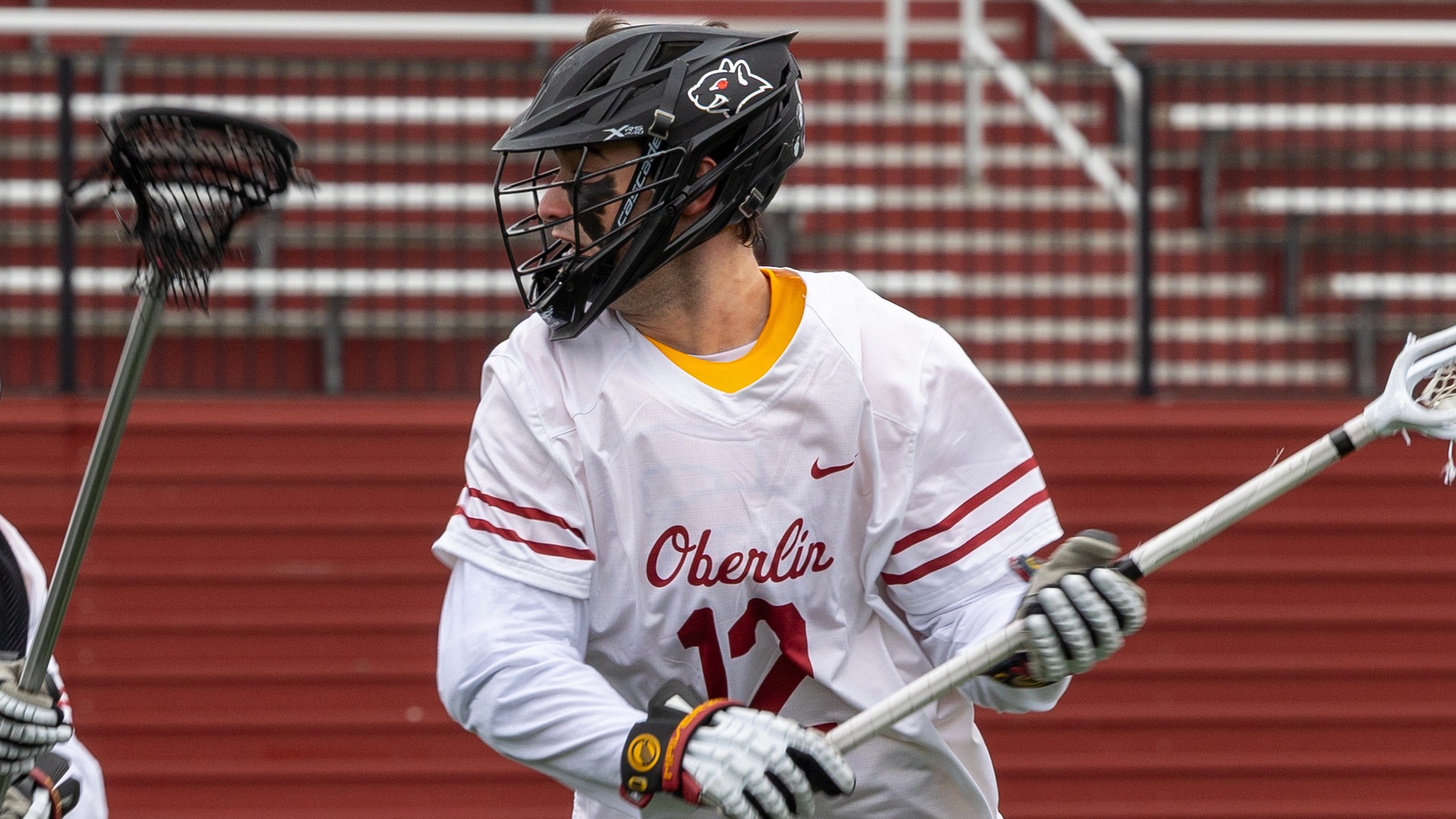 Cooper Zancosky looking to the left with lacrosse ball in stick