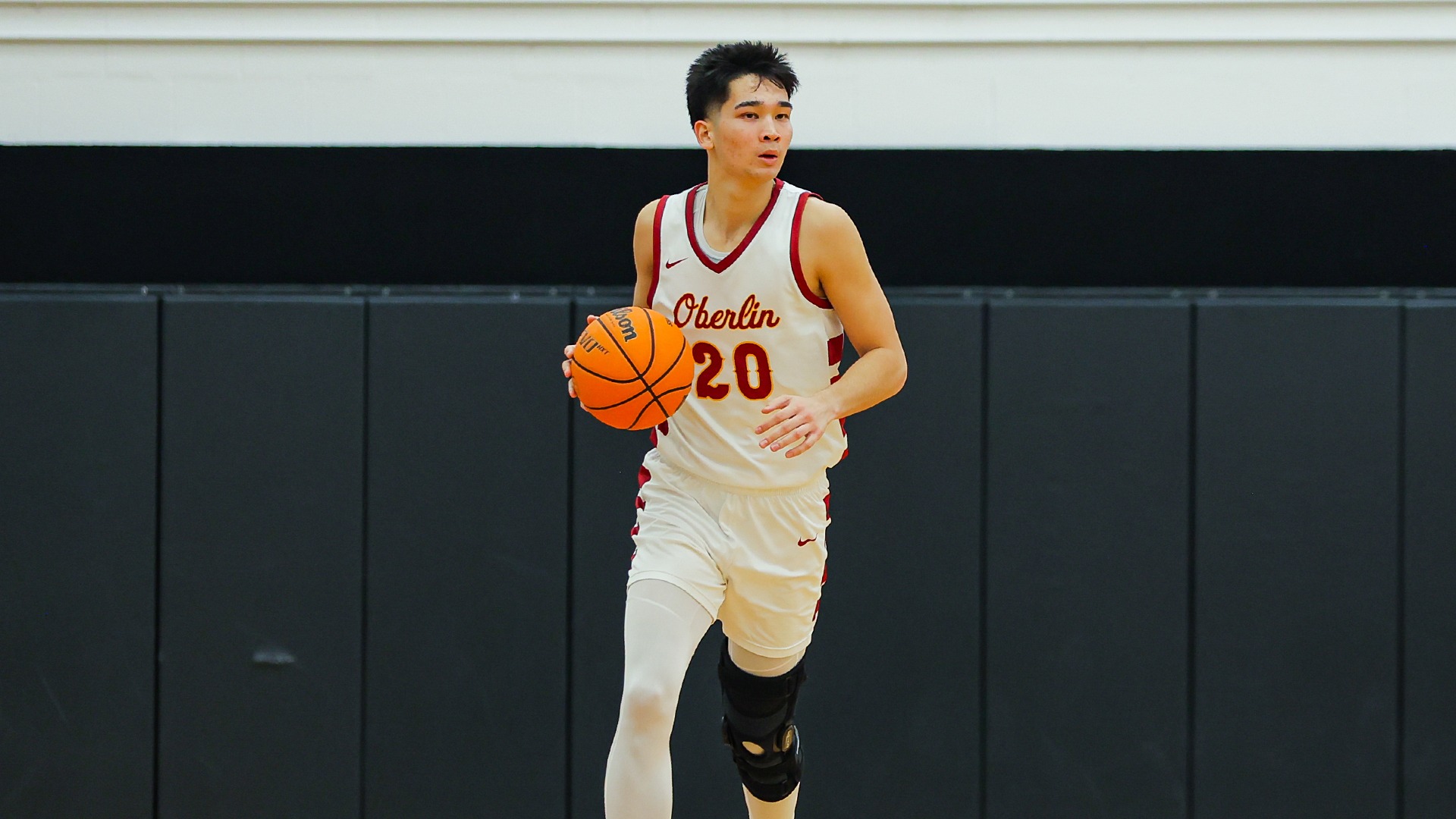 JJ Gray dribbling the ball down the court