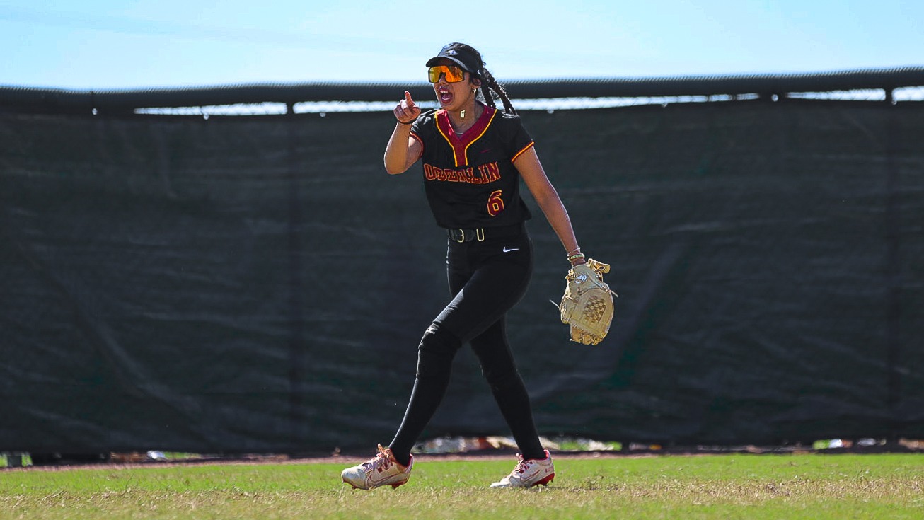 Anjali Singh pointing and cheering after a good play in the outfield