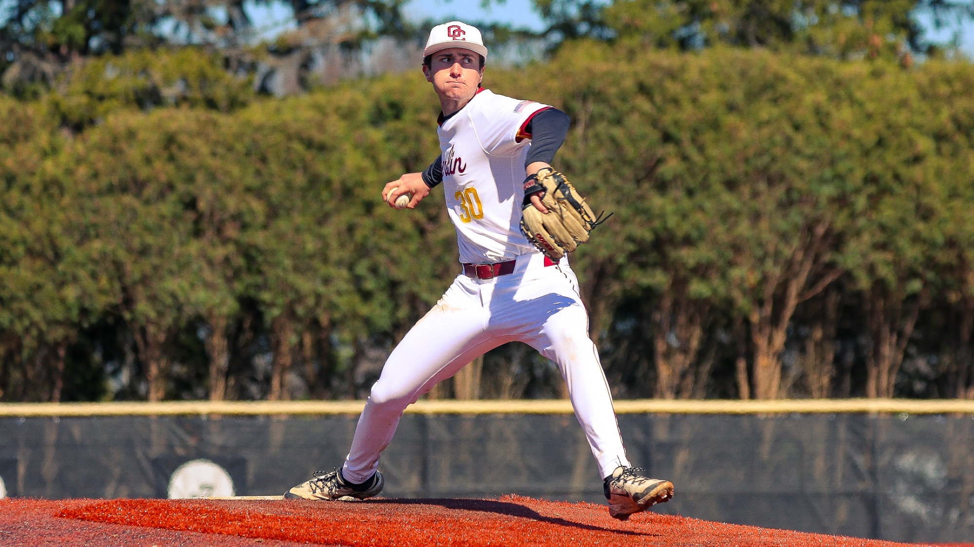 Jameson Bryant winding up to throw a baseball pitch