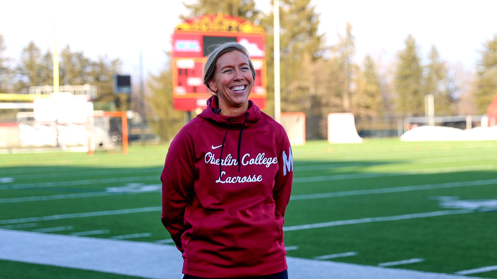 Malory Nadrah smiling at camera during interview on Bailey Field