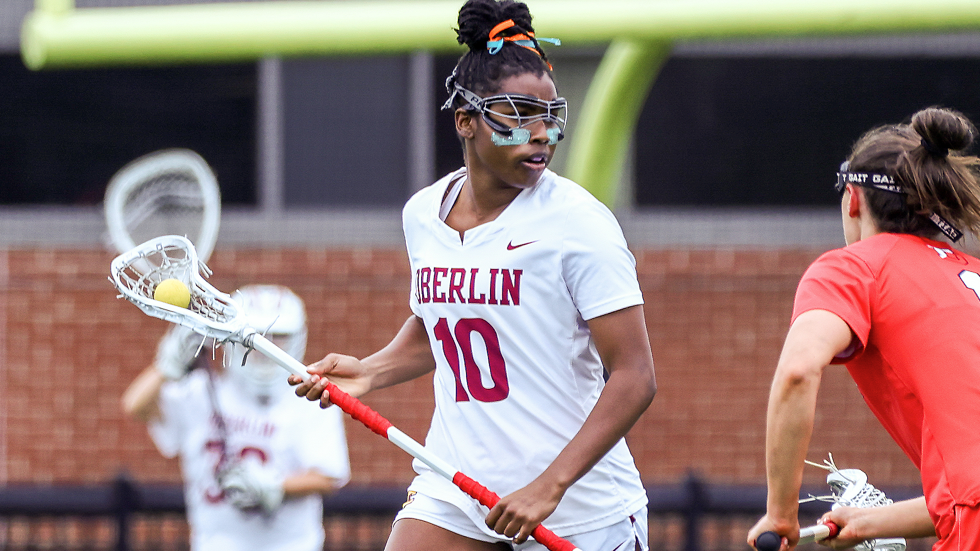 Maddie Weathers running with the lacrosse ball in her stick