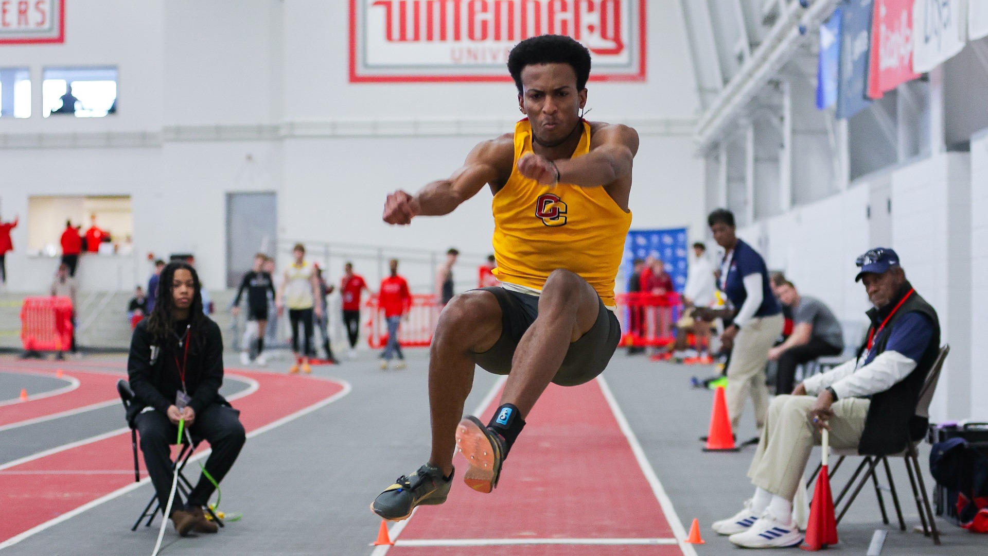 Namu Makatiani jumping in triple jump at NCAC Championships