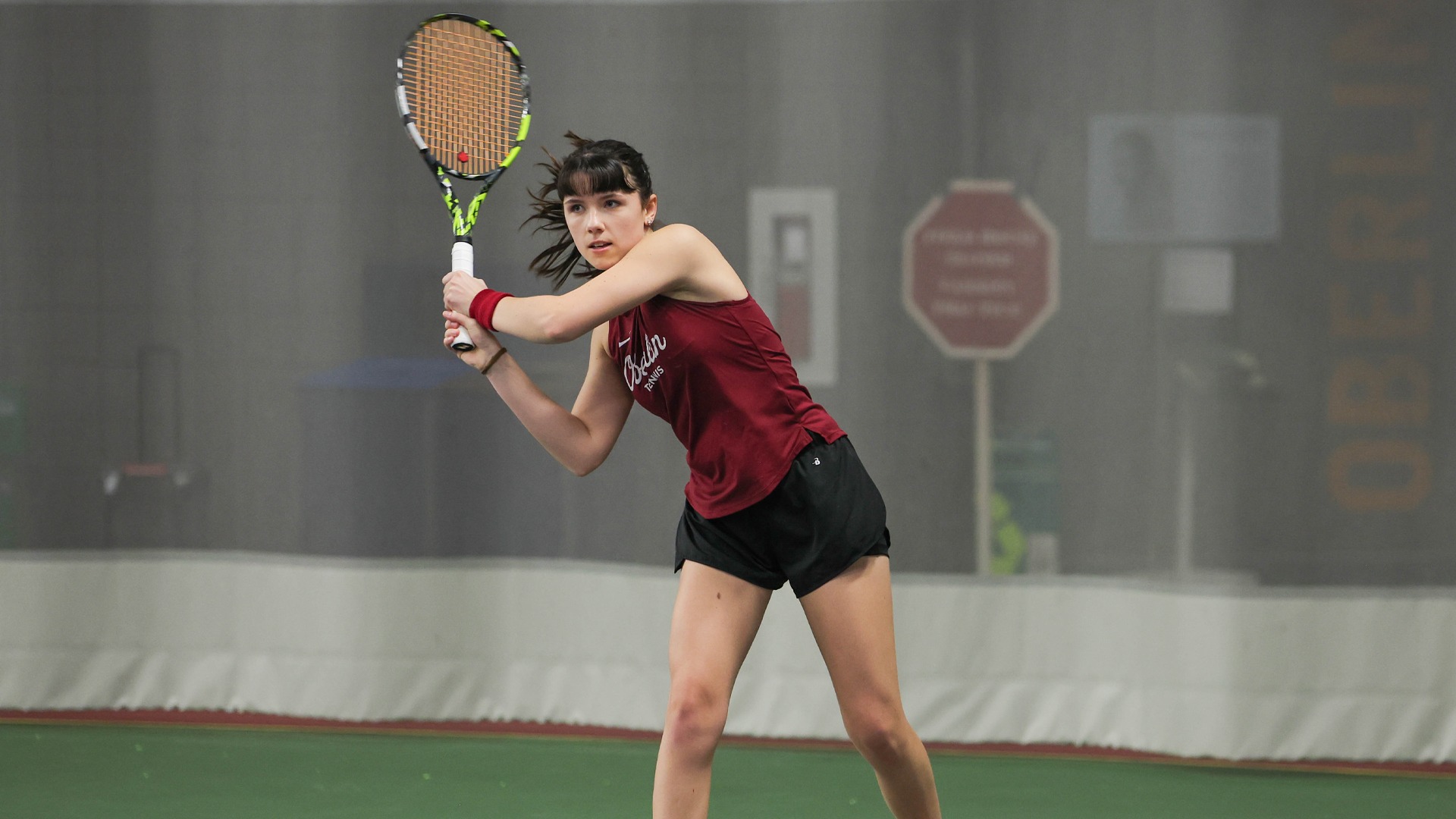 Scarlett Kingston follow-through after hitting tennis ball