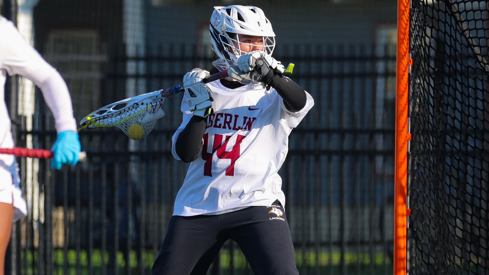 Emily Berger looking to pass the ball out of cage