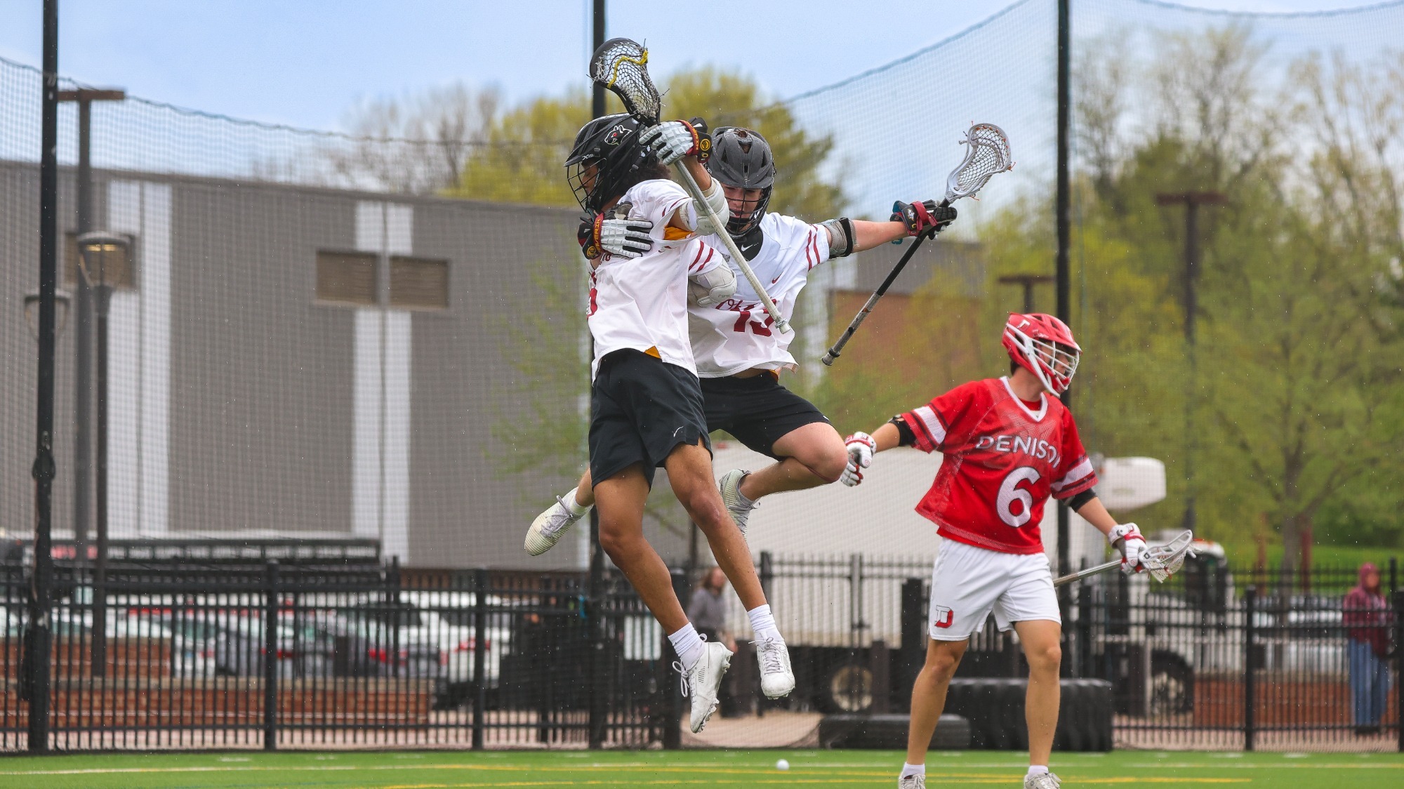 Solomon Brennan and Nicholas Cuda jumping and celebrating in the air