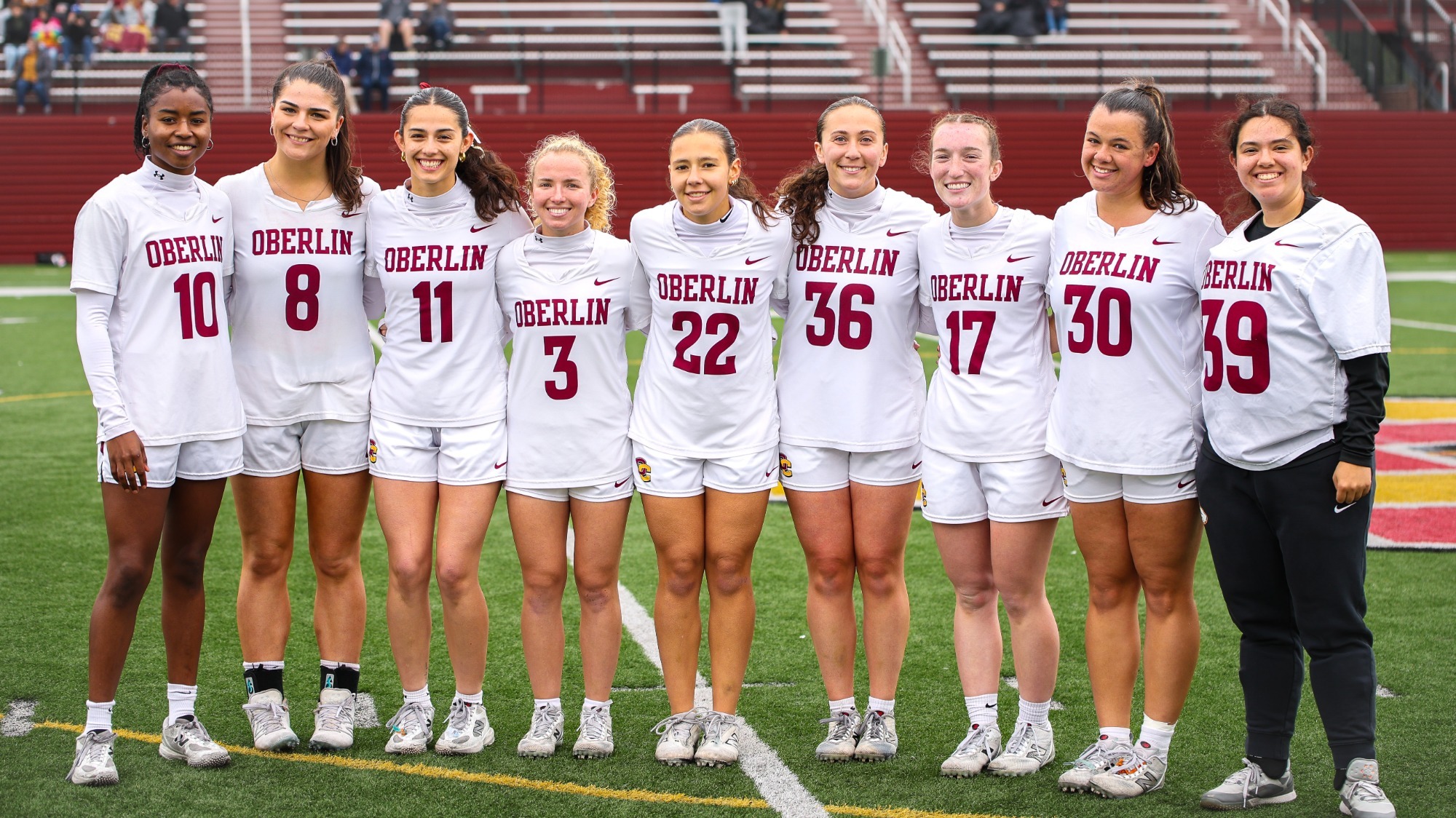 Women's Lacrosse Seniors Smiling for Photos 