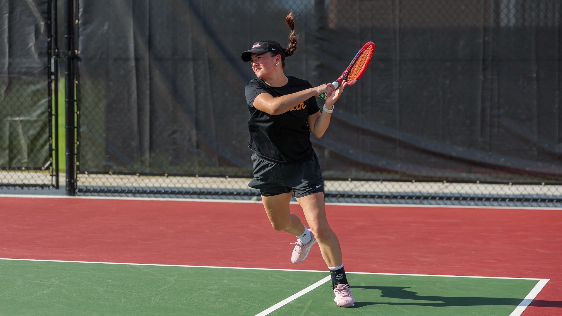 Hannah Soong racket followthrough after hitting tennis ball