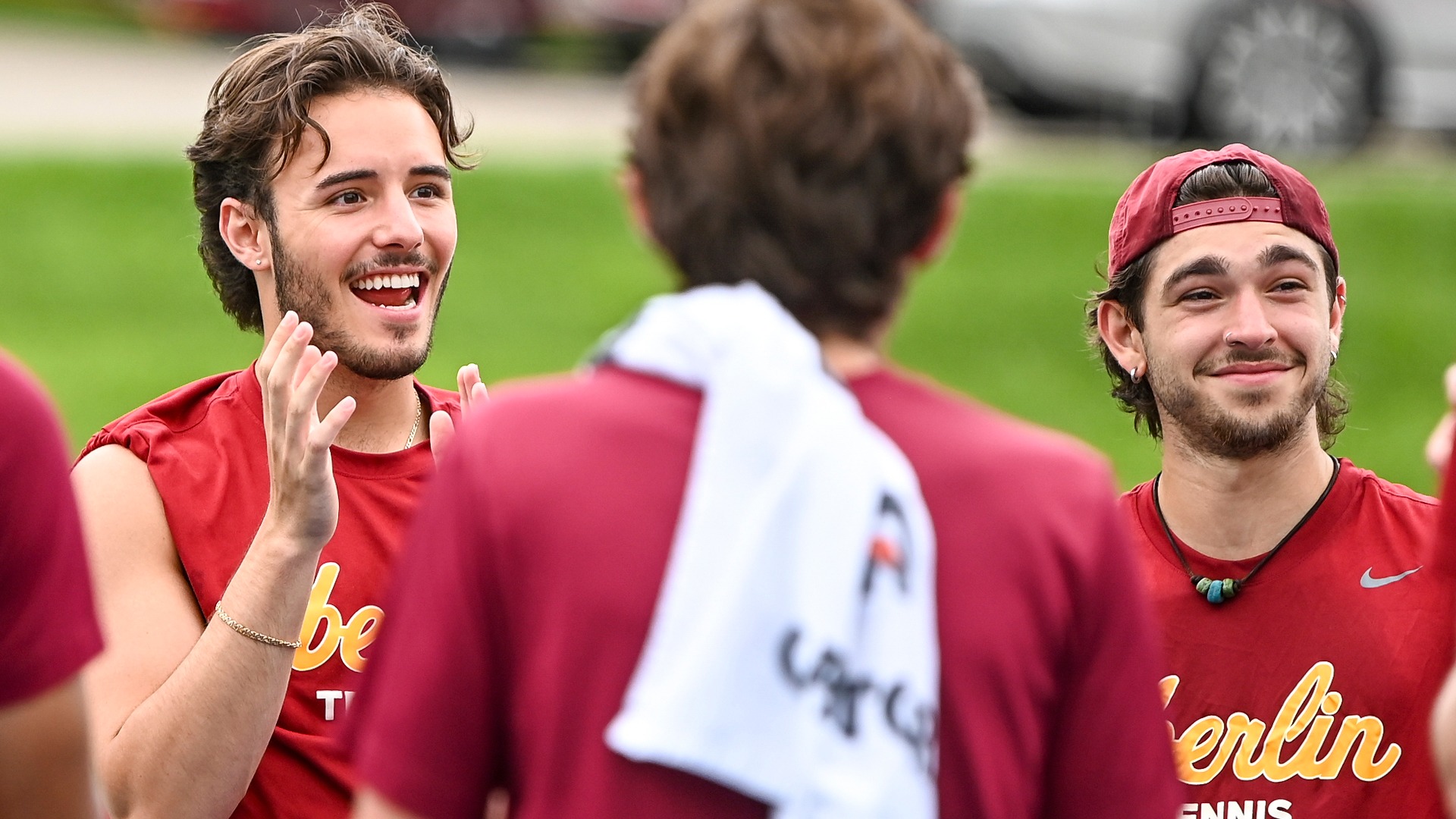 James Foster and Oliver Faranda smiling and clapping with team
