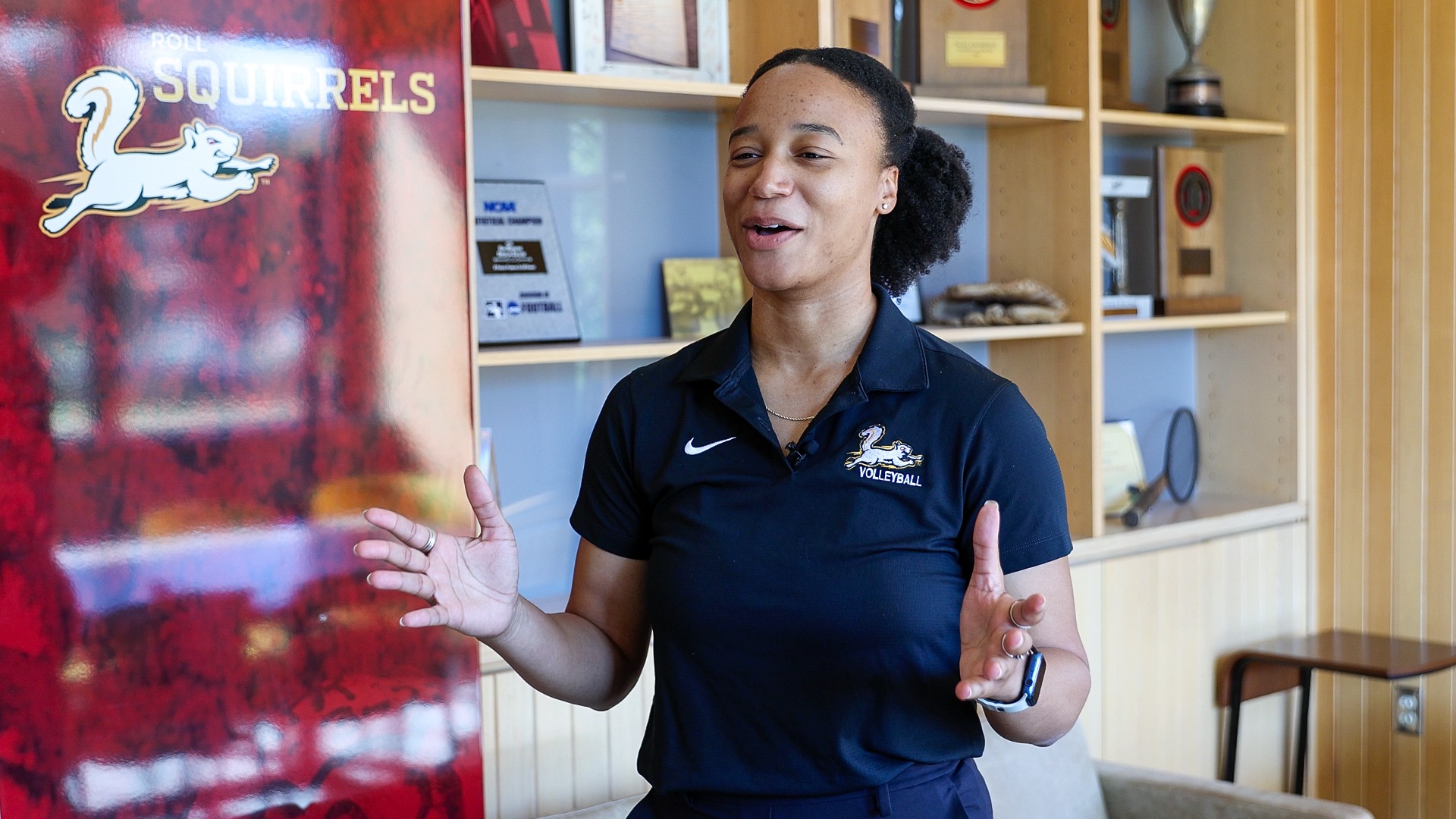 Jasmine Brown smiling during an interview in Heisman Conference Room