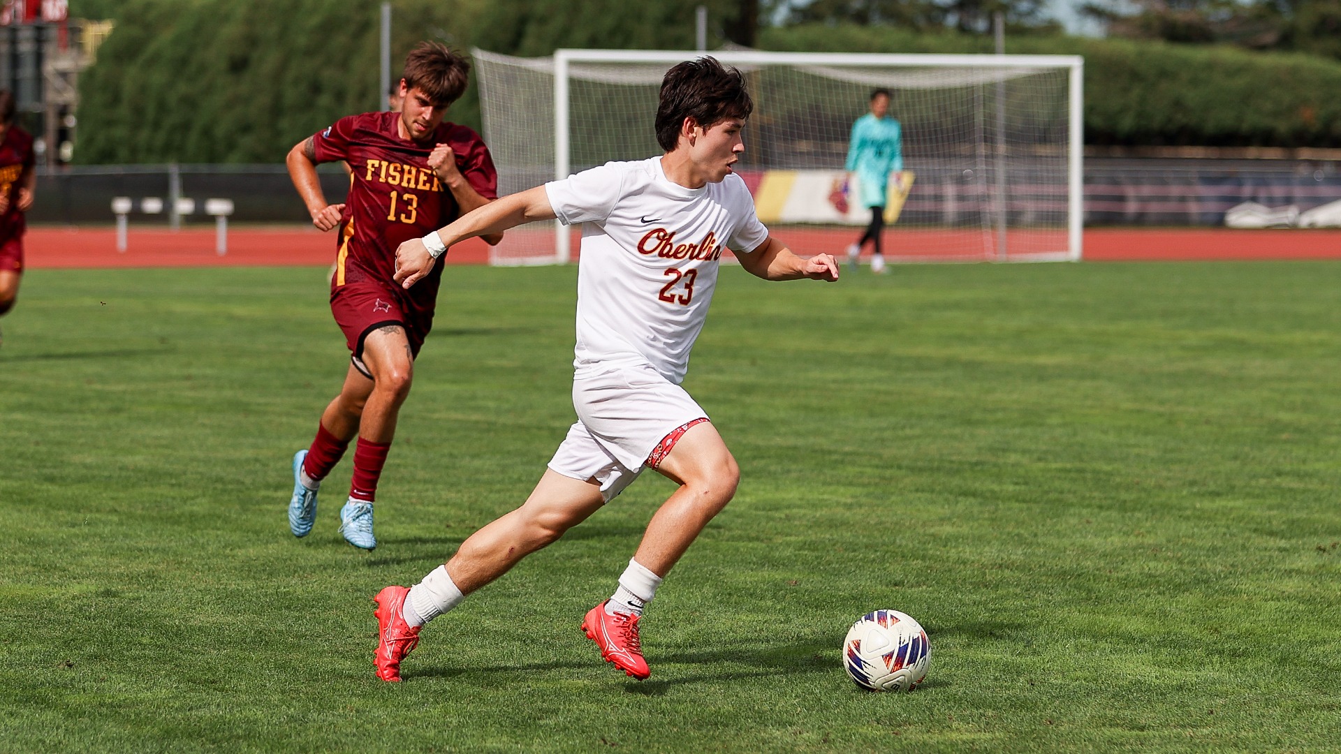 Kinton Surface running down the field with the ball