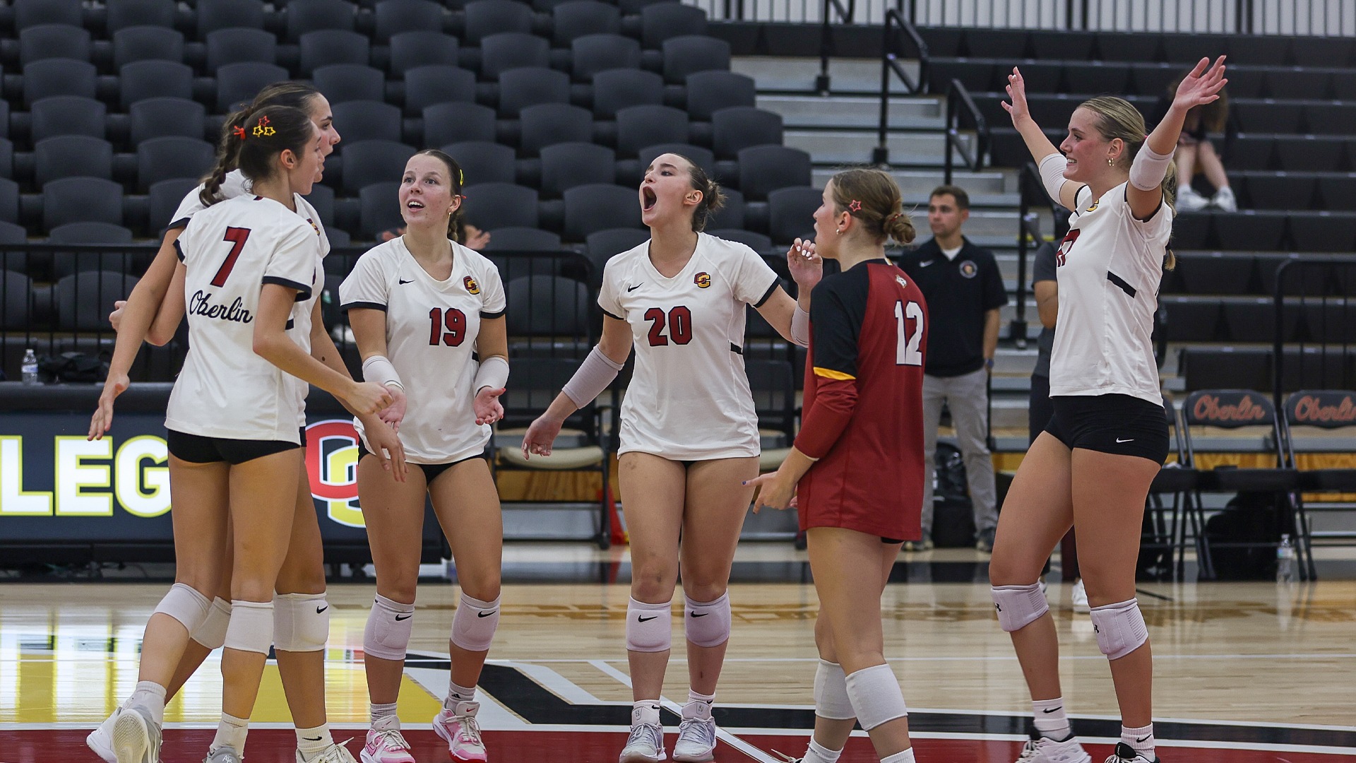 Volleyball team celebrating a point