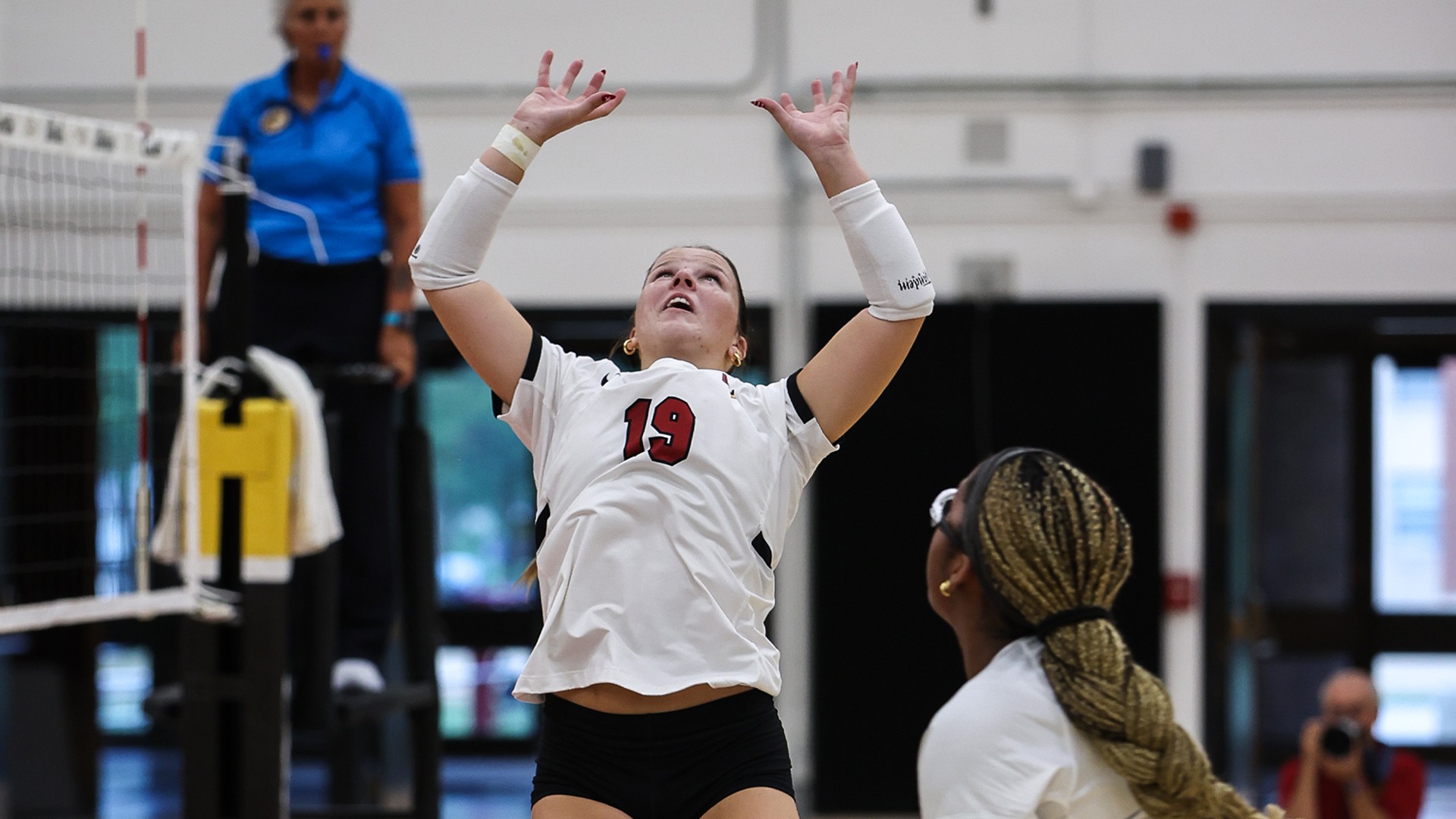 Emily Spangler setting the ball