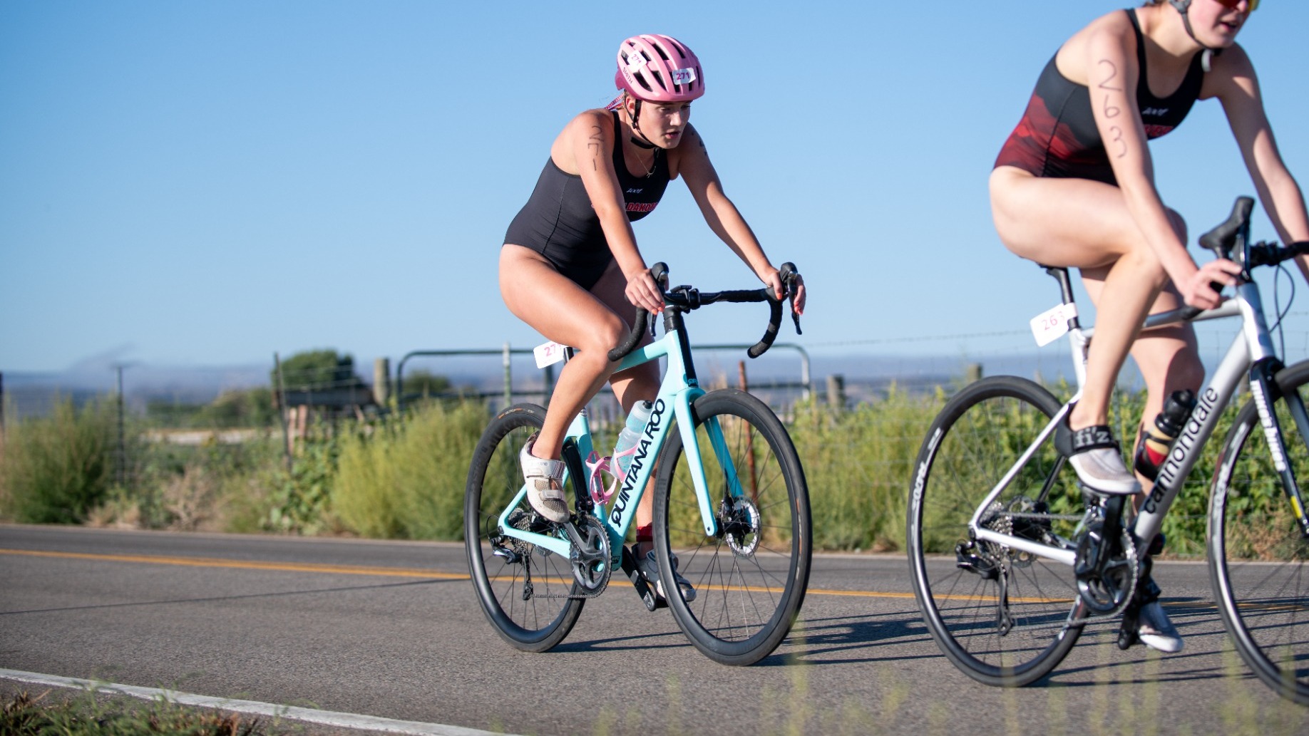 Clara Williams competes in the bike portion of the Desert's Edge Collegiate Cup
