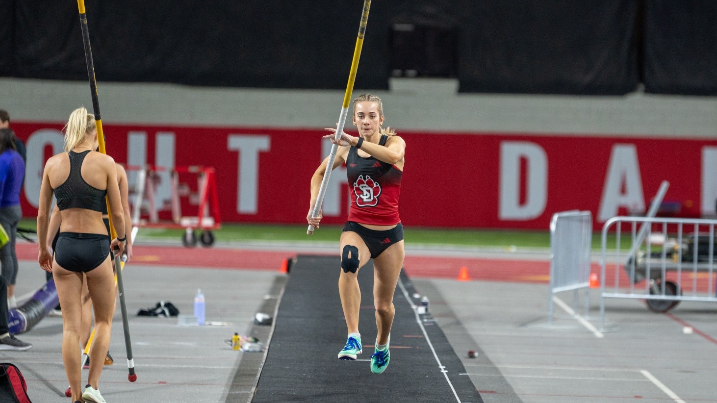 Anna Willis begins her run in the pole vault inside the DakotaDome