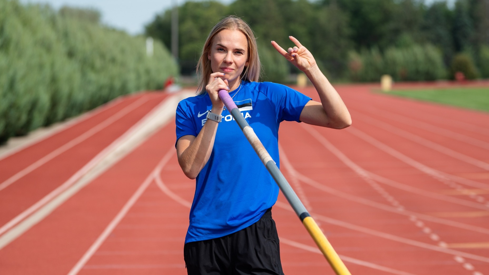 Marleen Mülla poses for a photo in her Team Estonia shirt