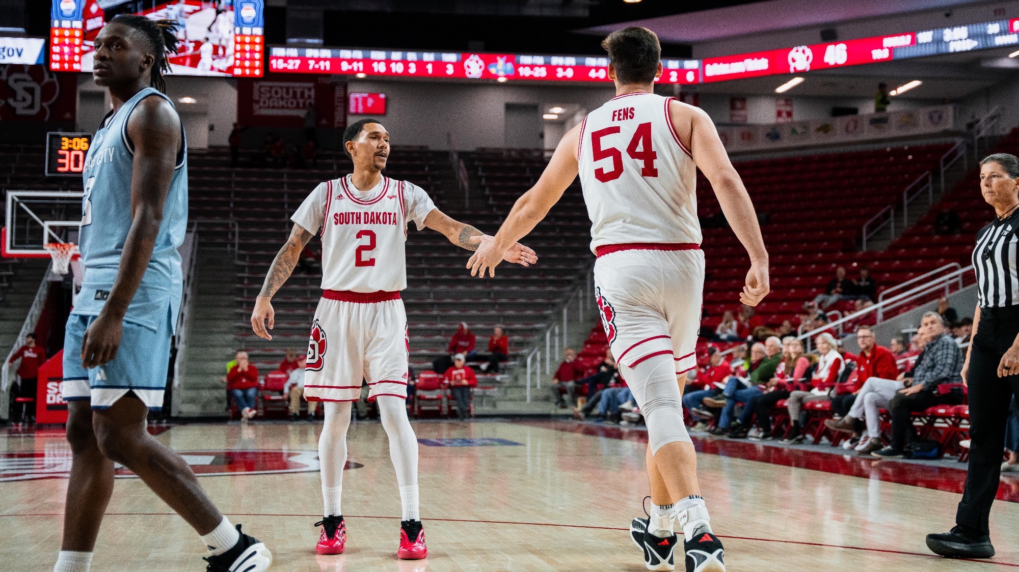 Trent Hudgens and Cam Fens high fiving after a bucket vs Kansas City 011526