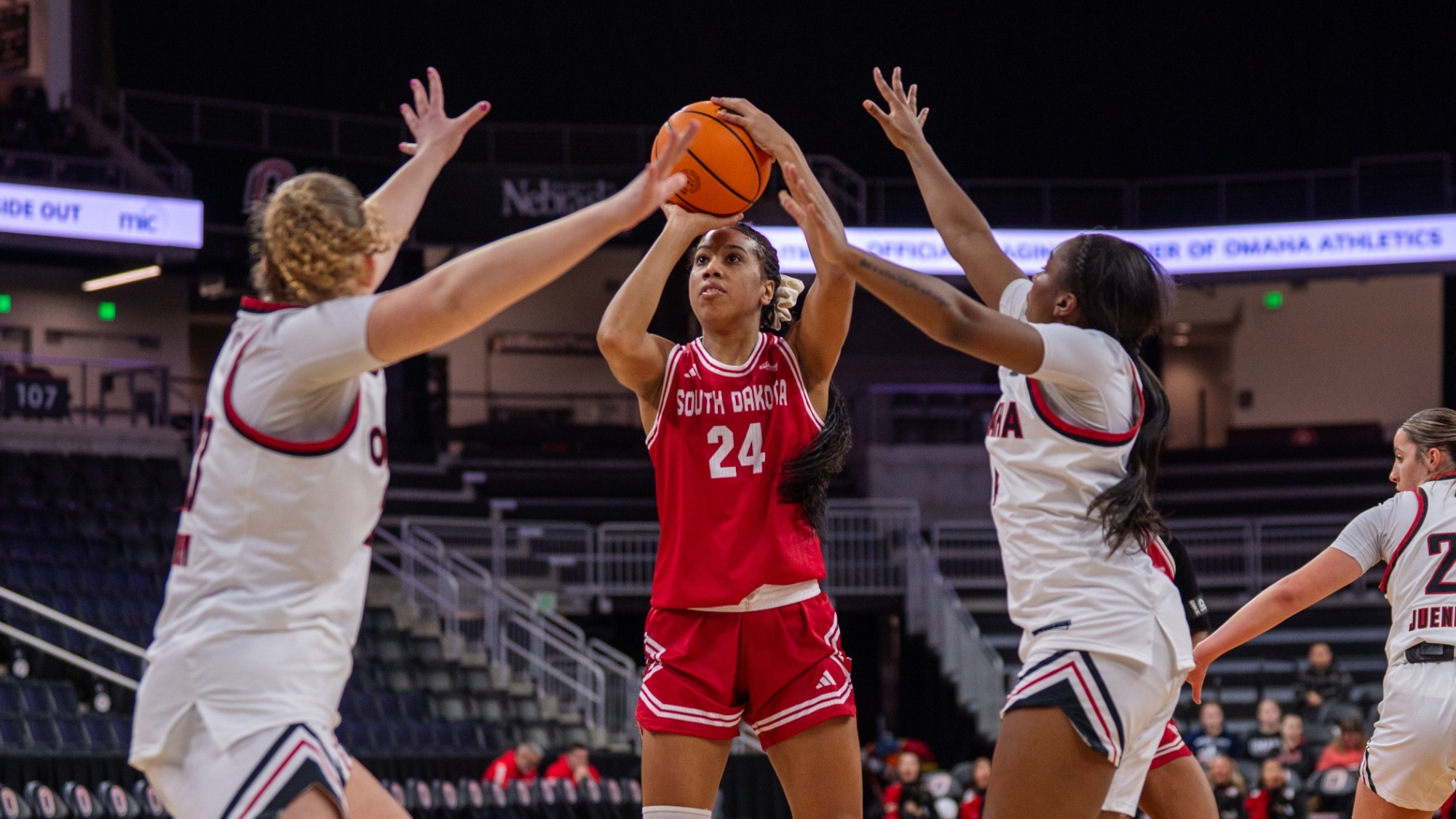 Elise Turrubiates puts up a shot over two Omaha defenders in Baxter Arena