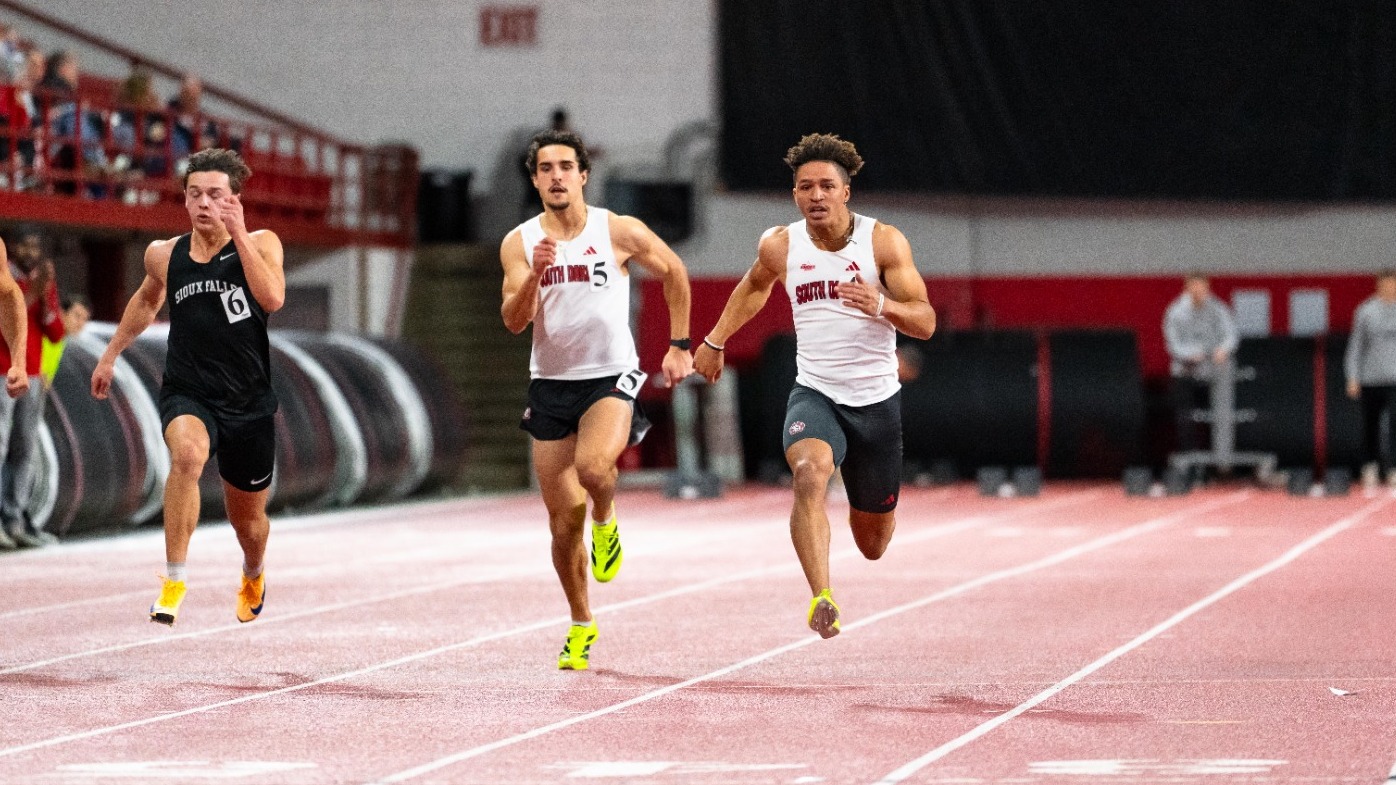 Ethan Baessler and Jaden Damiano compete in the 60-meters at the USD Alumni Meet