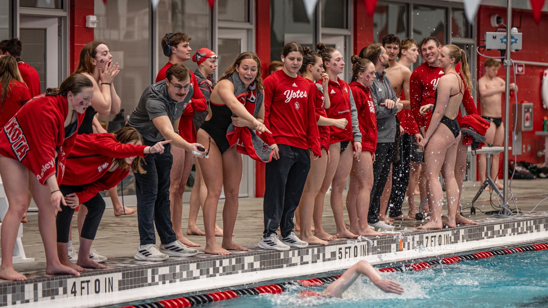 Swim team cheers on swim members