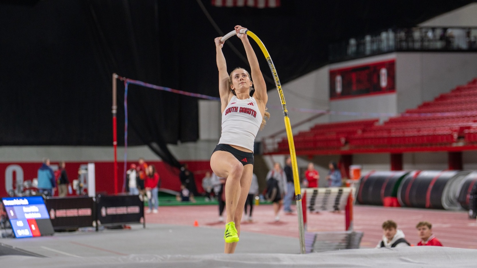 Anna Willis competes in the pole vault at the USD Alumni Meet