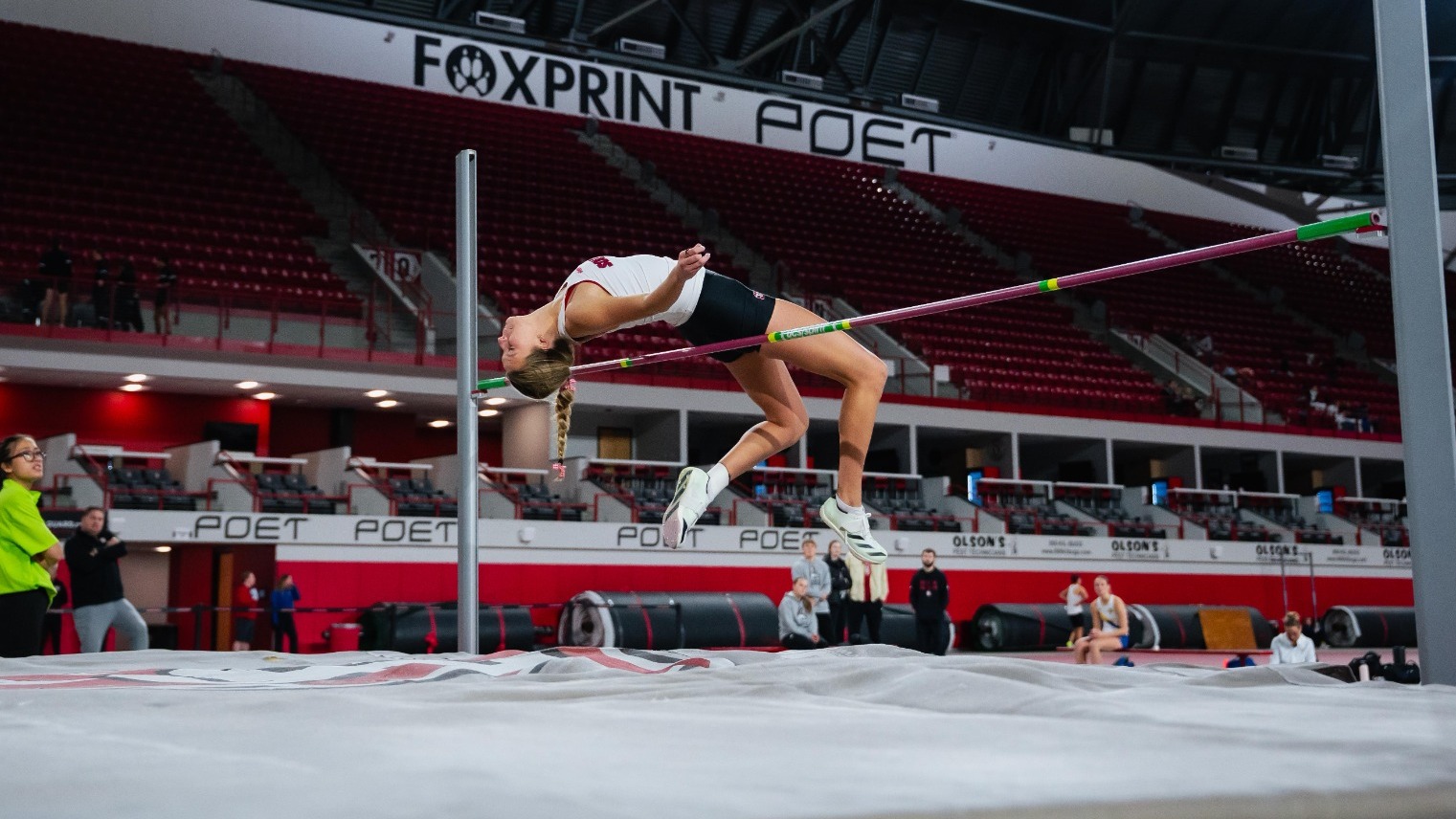 Maddie Olson competes in the high jump at the USD Alumni Meet