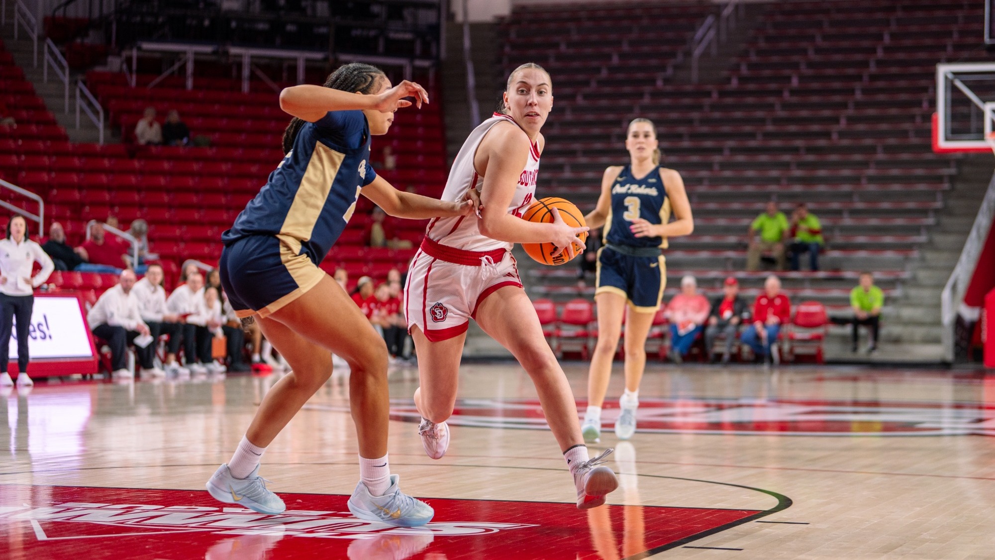 Alex Flattery drives the ball to the basket against Oral Roberts in the SCSC