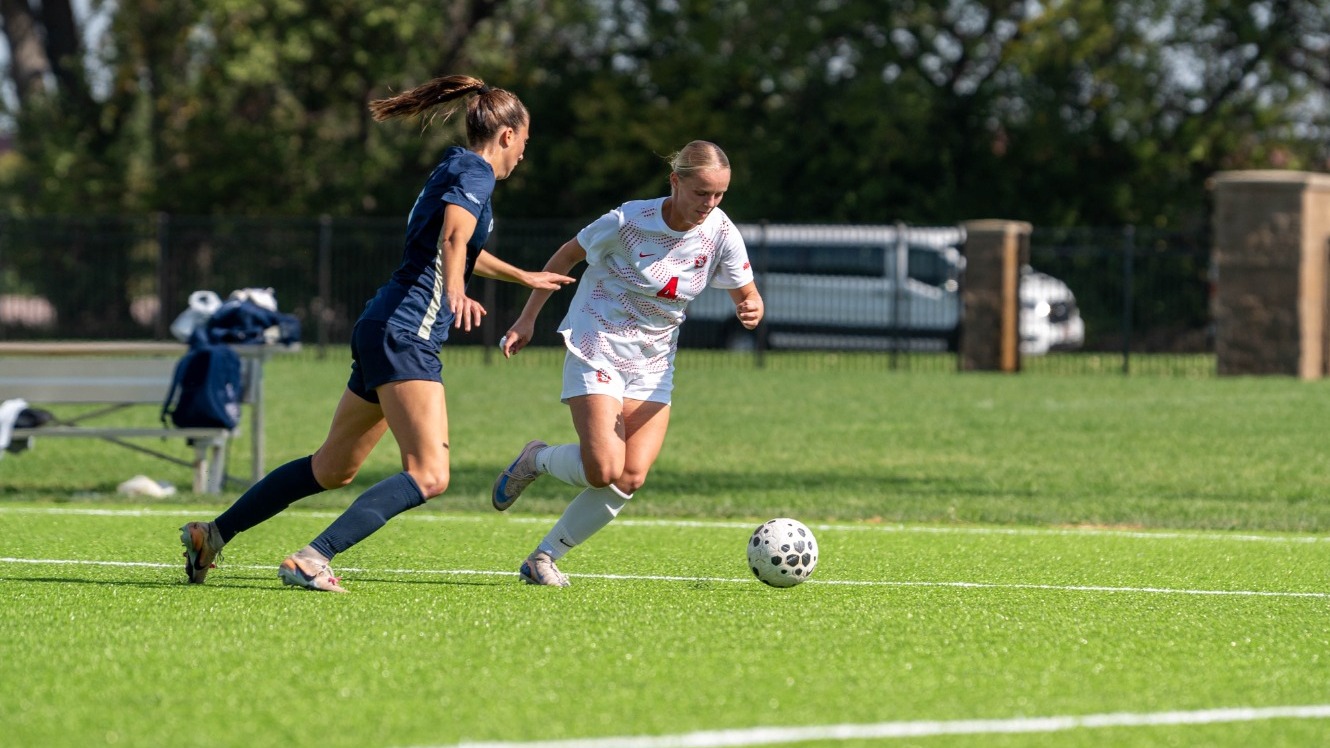 Elsie Odney drives past Oral Roberts defender.