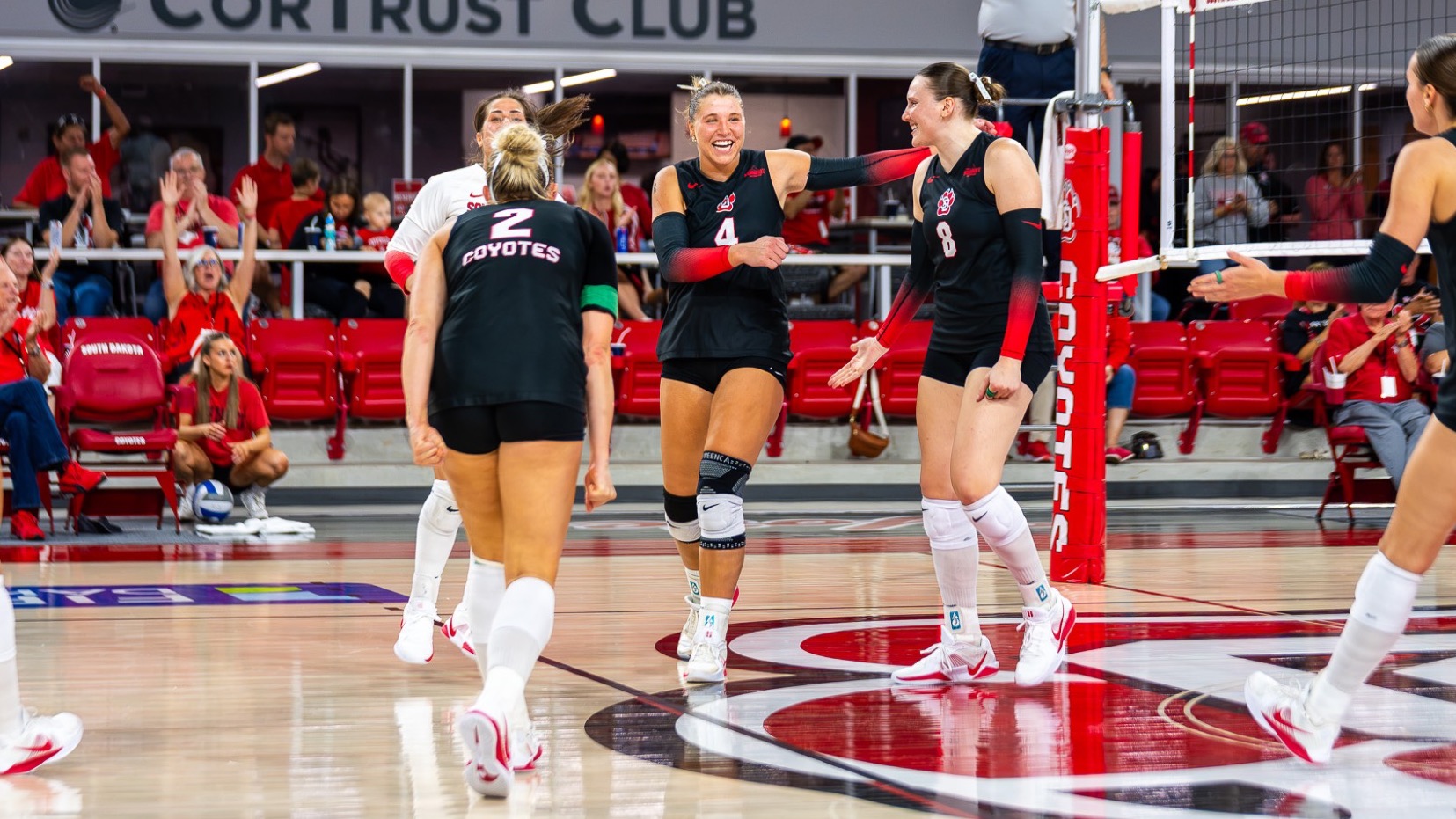 Volleyball team celebrating a point 2026 season