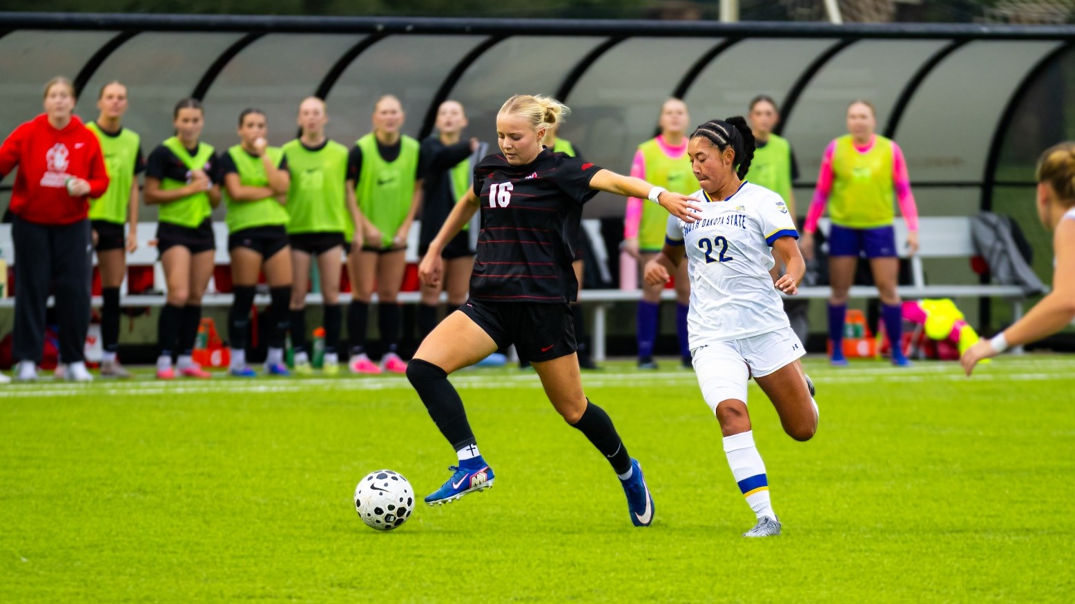 Brooklynn Pollmiller drives past SDSU defender.